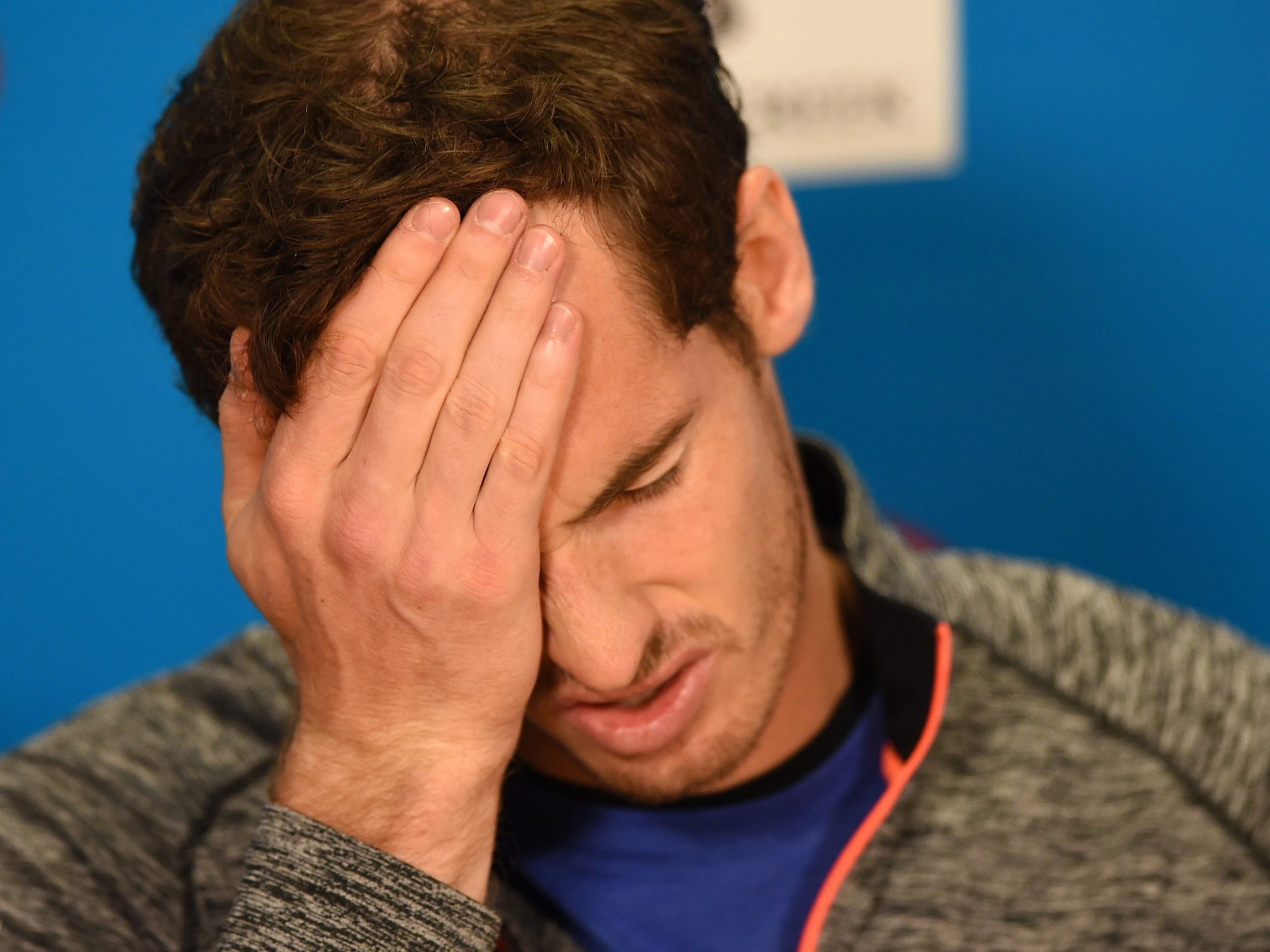 Andy Murray with his head in his hands