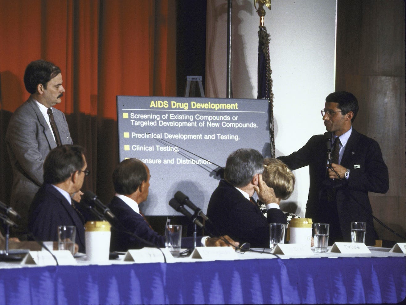 Fauci lectures former President Ronald W. Reagan (left) and other members of the President's Commission on AIDS.