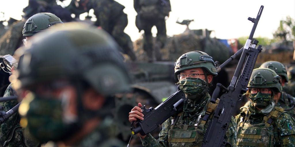Taiwanese soldiers holding grenade launchers and machine guns, during an operation as part of the 37th edition of the HanKuang military exercise, in Tainan, Taiwan, 14 September 2021
