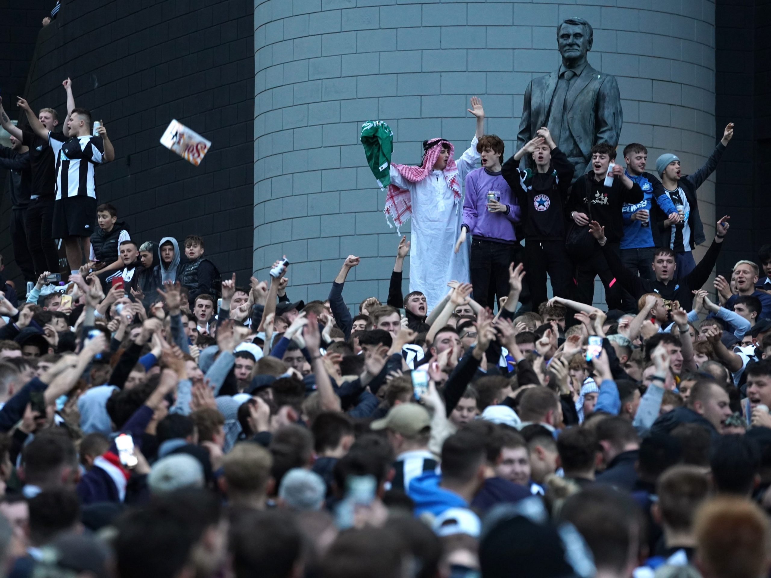 Newcastle United fans celebrate at St James' Park following the announcement that The Saudi-led takeover of Newcastle has been approvedon Thursday October 7, 2021.