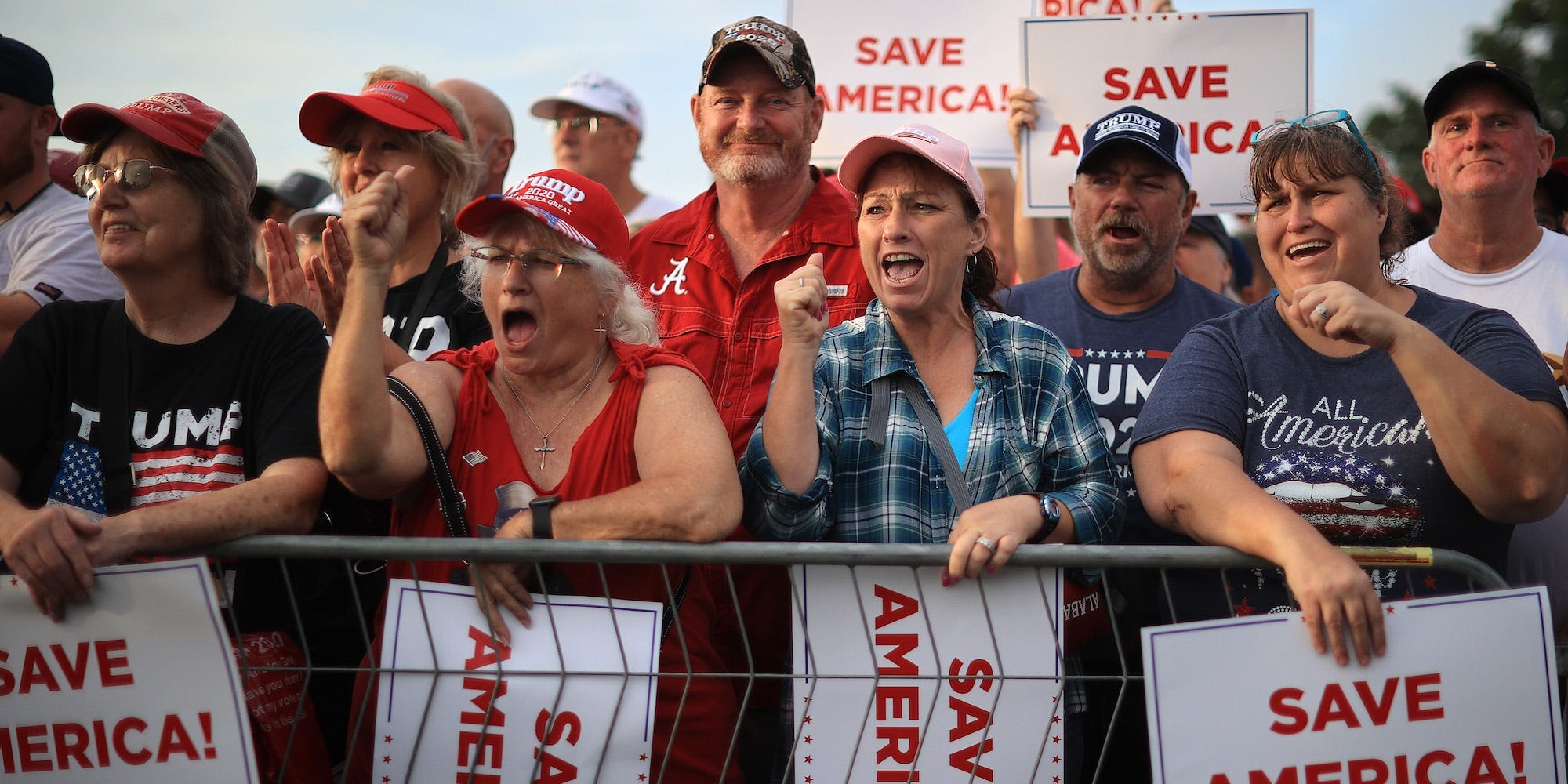 Supporters of former President Donald Trump listen to local and state politicians speak during a "Save America" rally on August 21, 2021 in Cullman, Alabama.