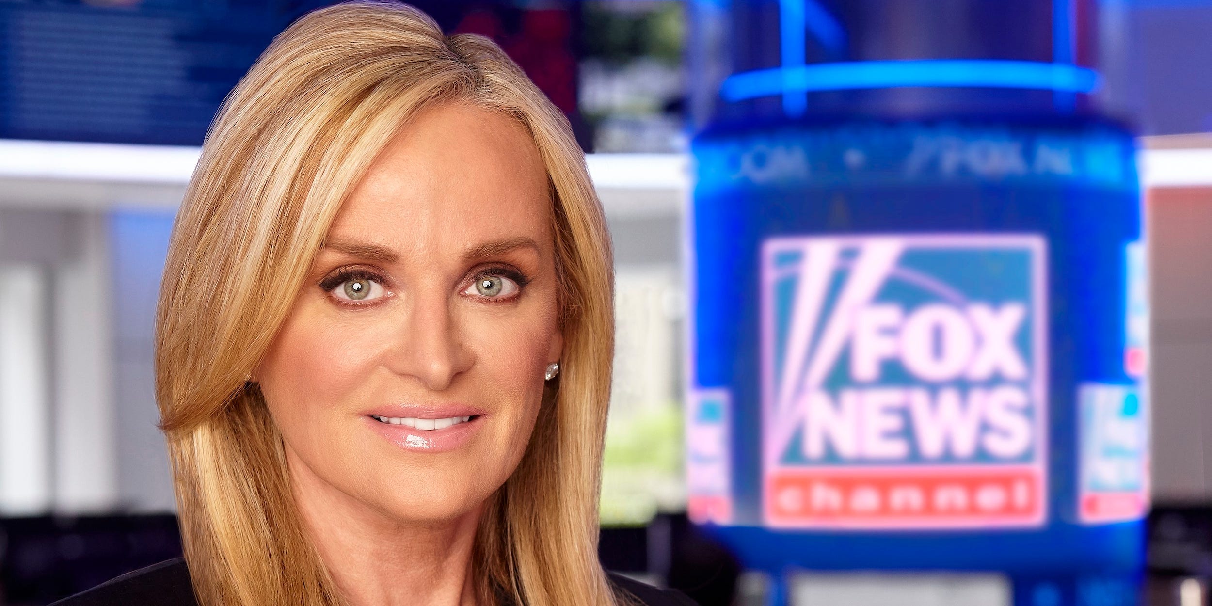 Headshot of Fox News CEO Suzanne Scott in studio.