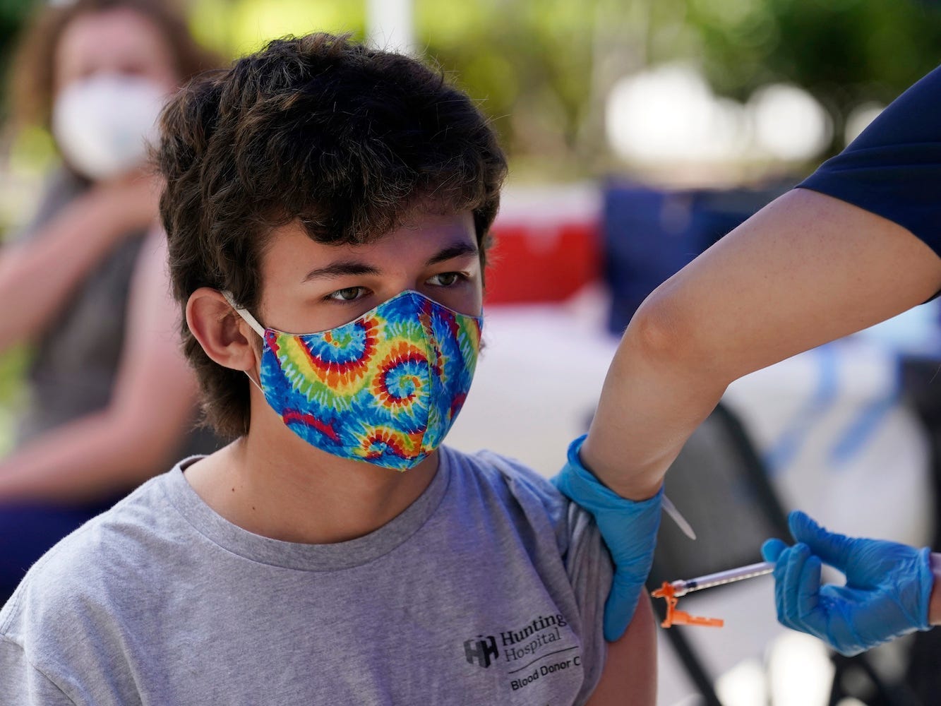 Finley Martin, 14, gets a shot of the Pfizer COVID-19 vaccine at the First Baptist Church of Pasadena Friday, May 14, 2021, in Pasadena, Calif.