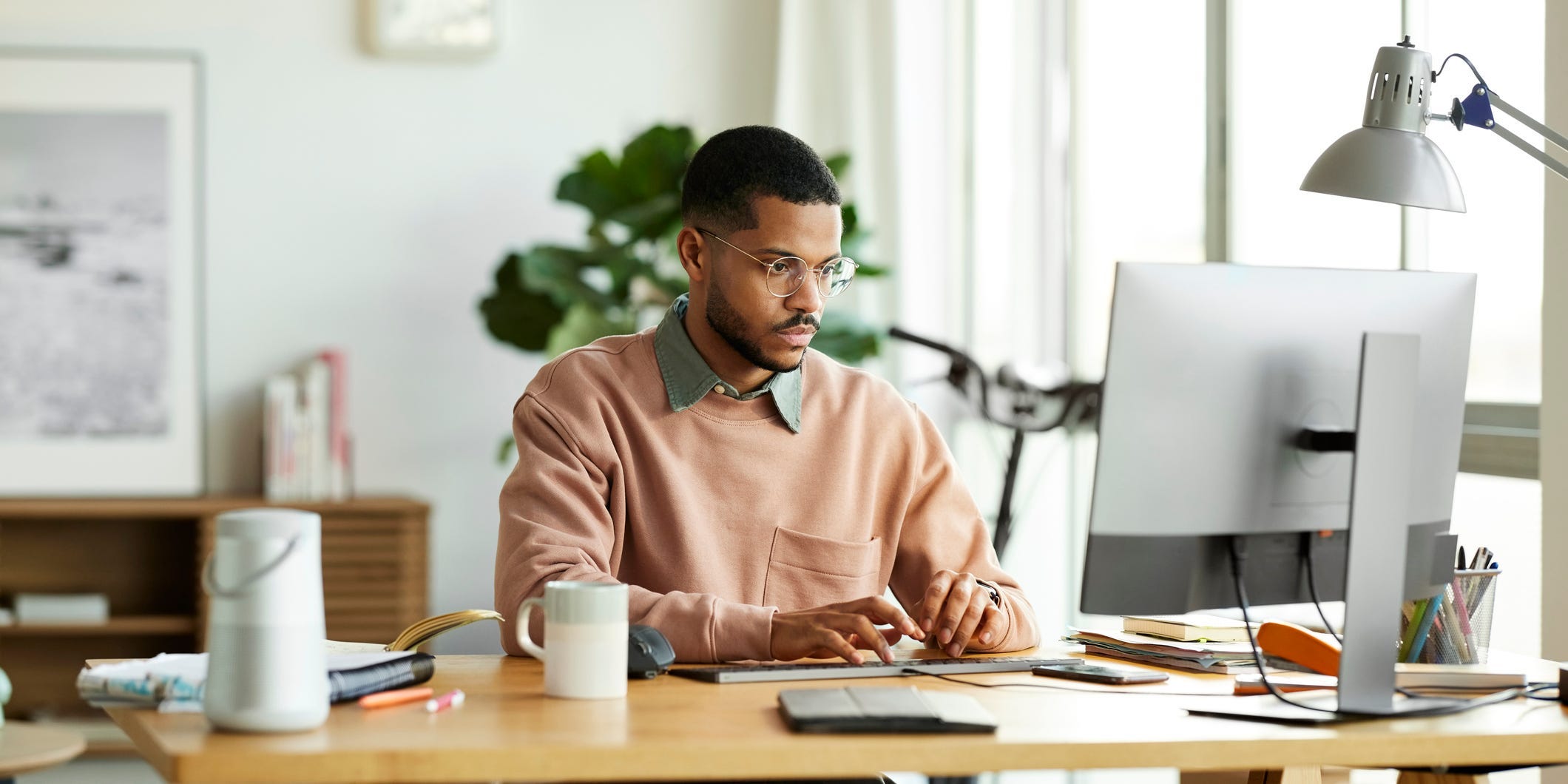 man sitting at desk.