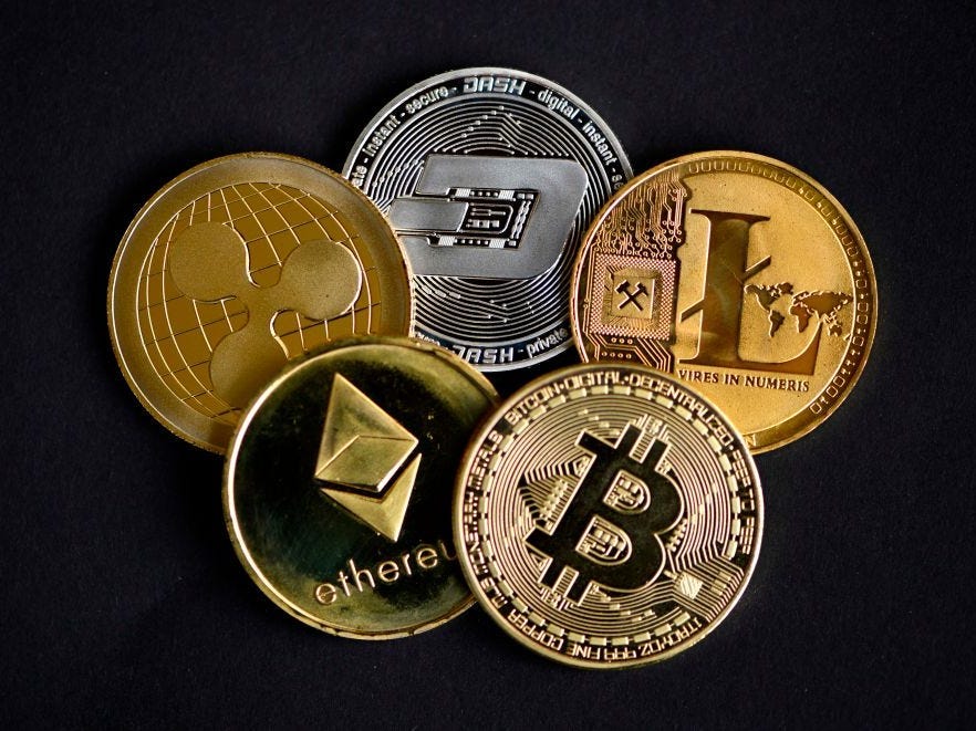 The photo shows physical imitations of cryptocurrency