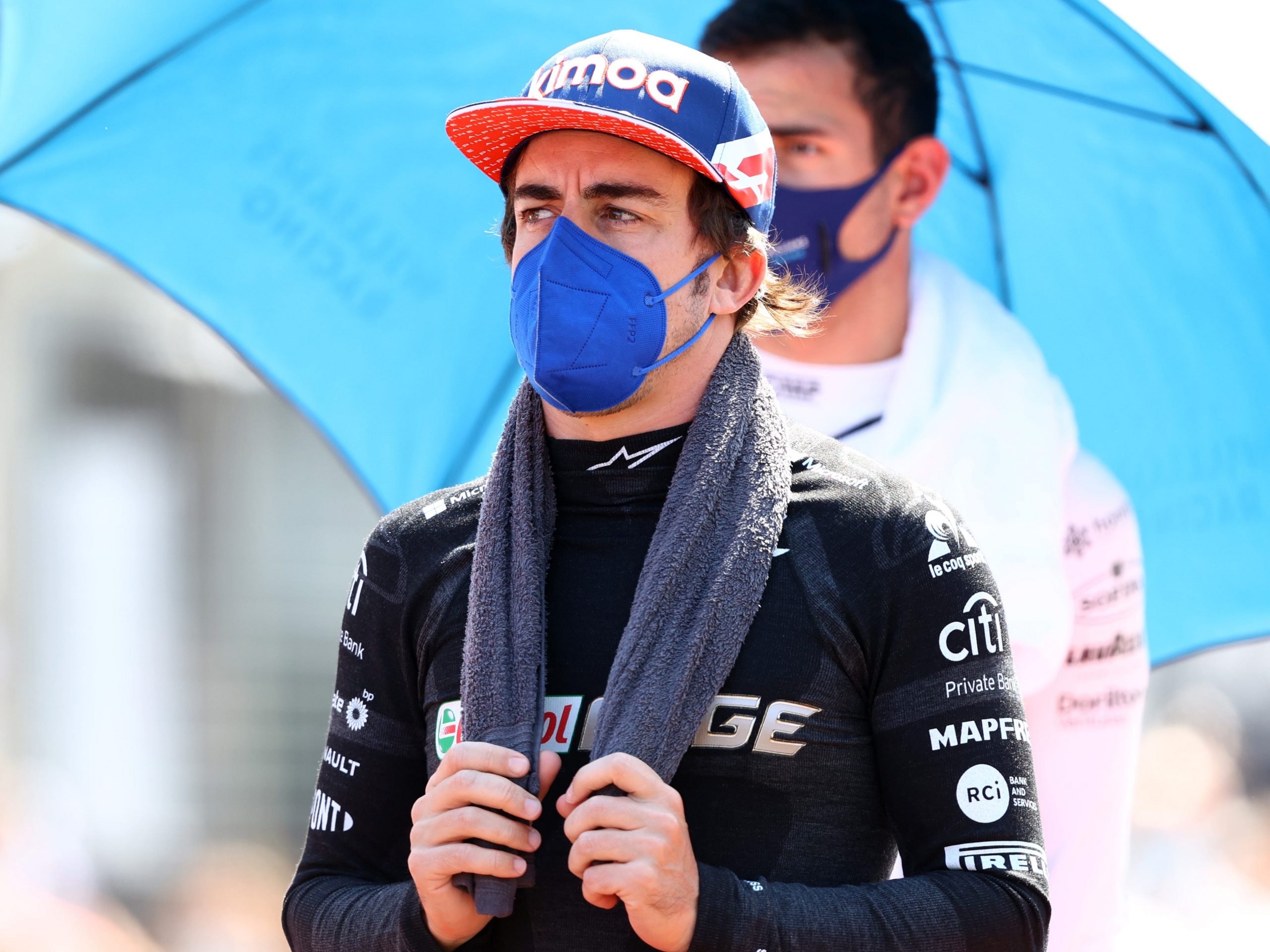 Fernando Alonso holds a towel round his neck