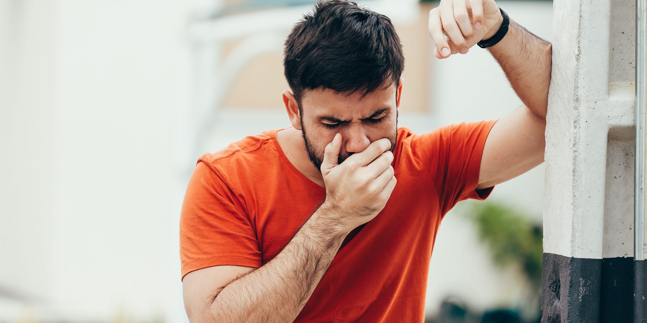 man feeling nauseous