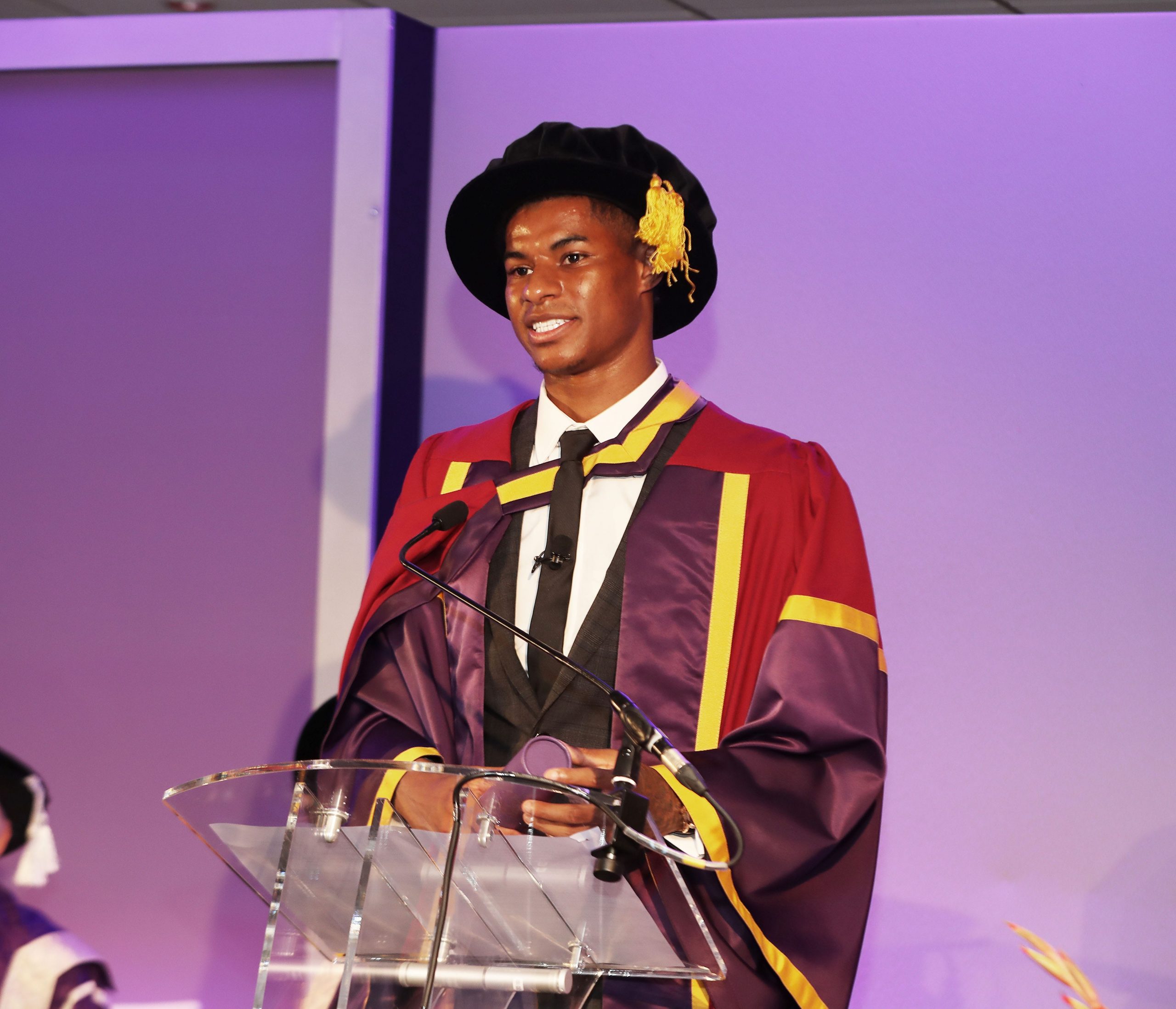 Manchester United player Marcus Rashford receiving an honorary doctorate from the University of Manchester.