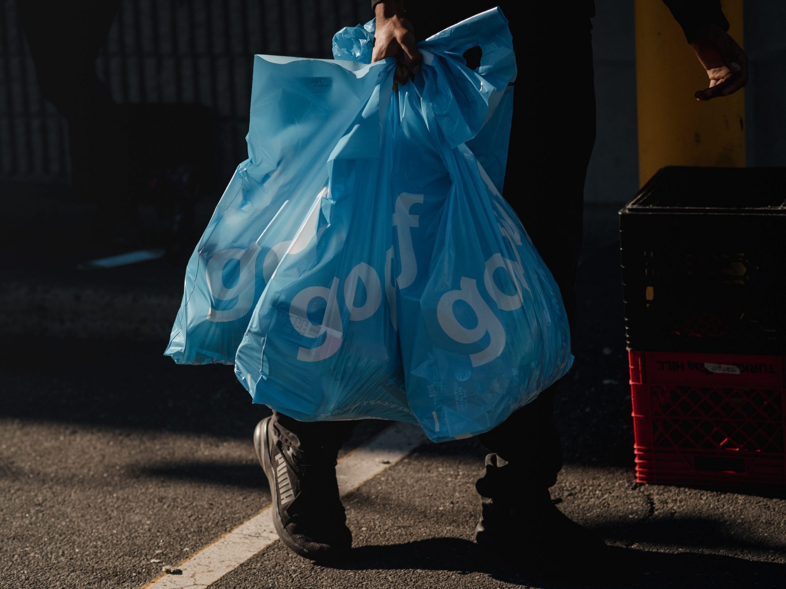 Gopuff bags are carried near one of the company's warehouses.