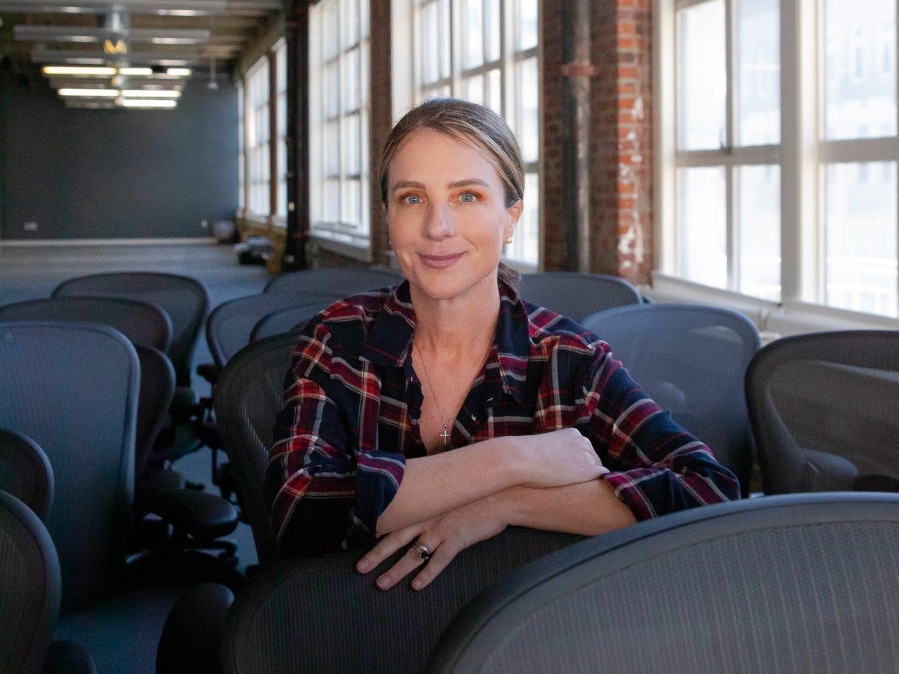 woman sitting in office chairs