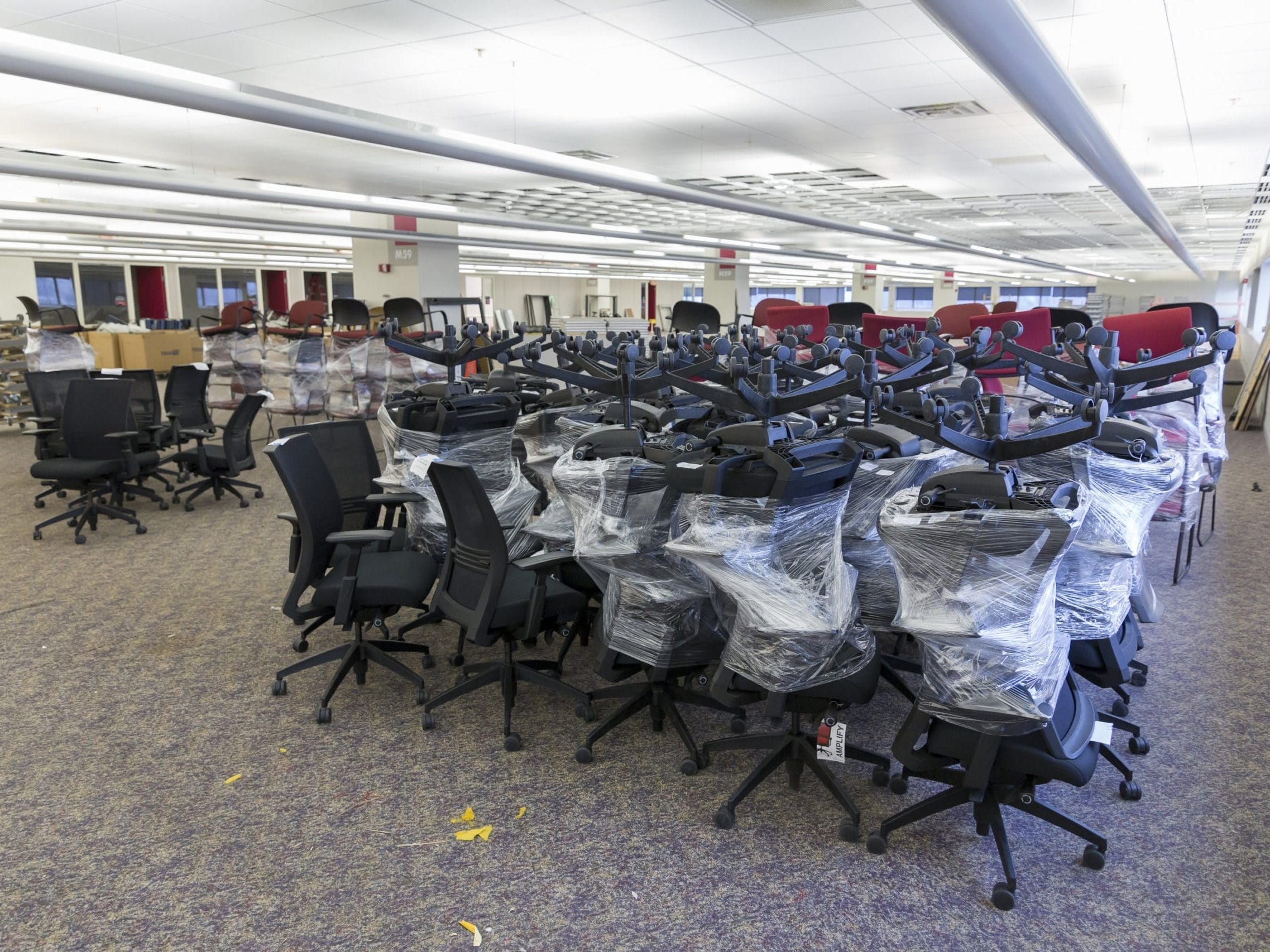 office furniture packed up in piles