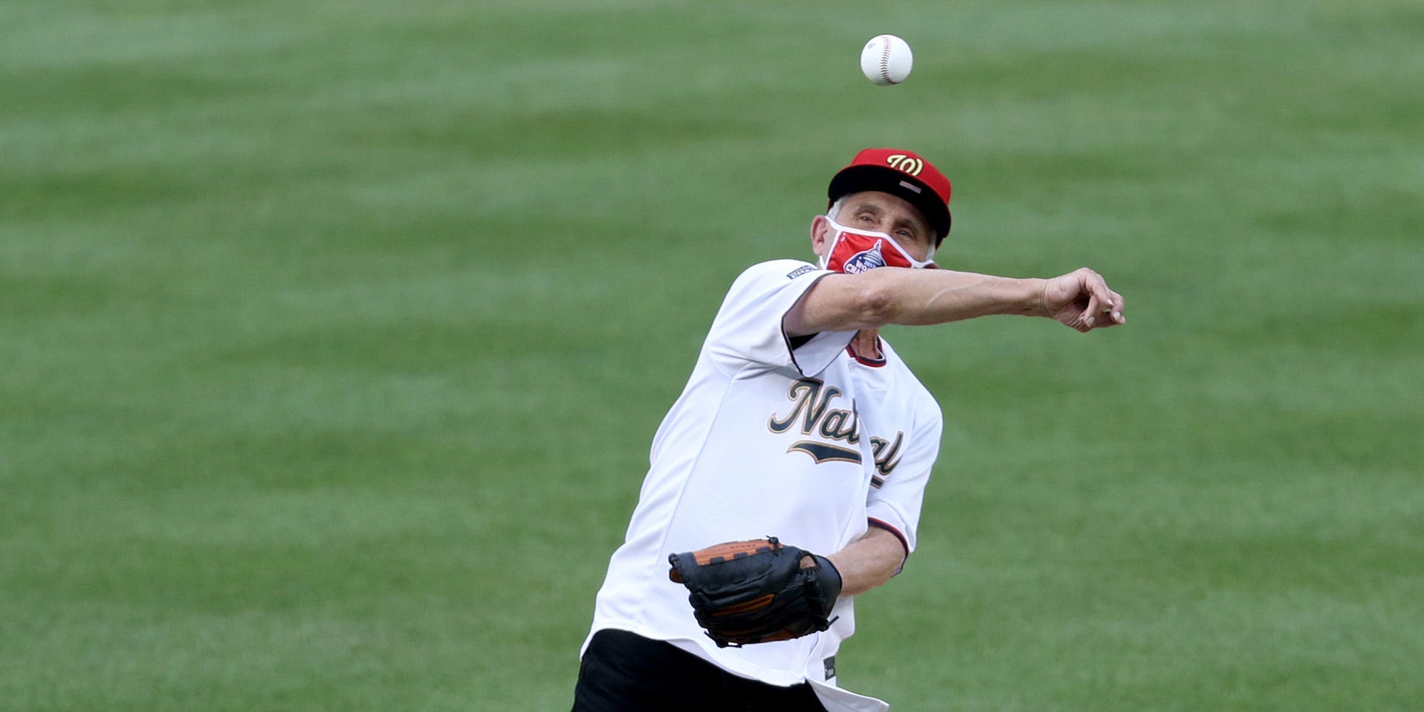 Dr. Anthony Fauci, director of the National Institute of Allergy and Infectious Diseases, throws out the ceremonial first pitch prior to the game between the New York Yankees and the Washington Nationals at Nationals Park on July 23, 2020.