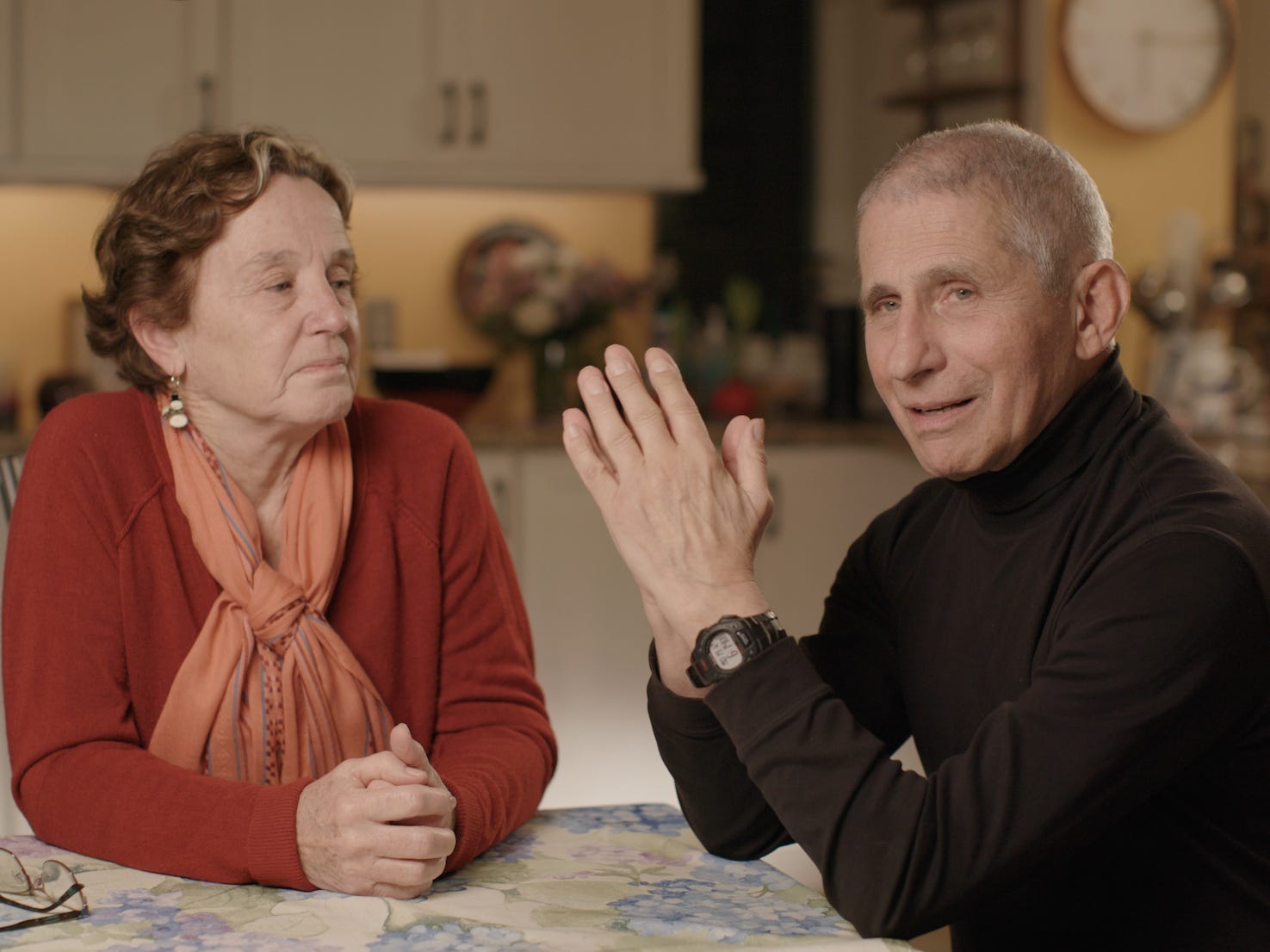 christine grady and anthony fauci sit at their kitchen table