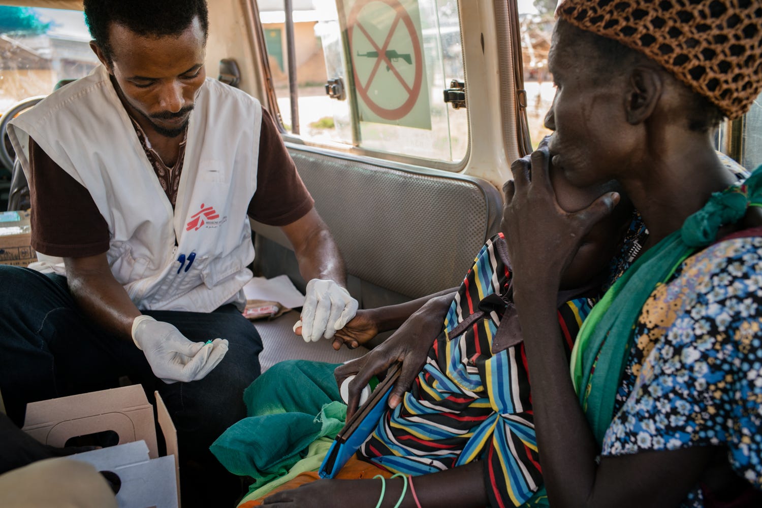 A nurse is seen administering a test to a young boy.