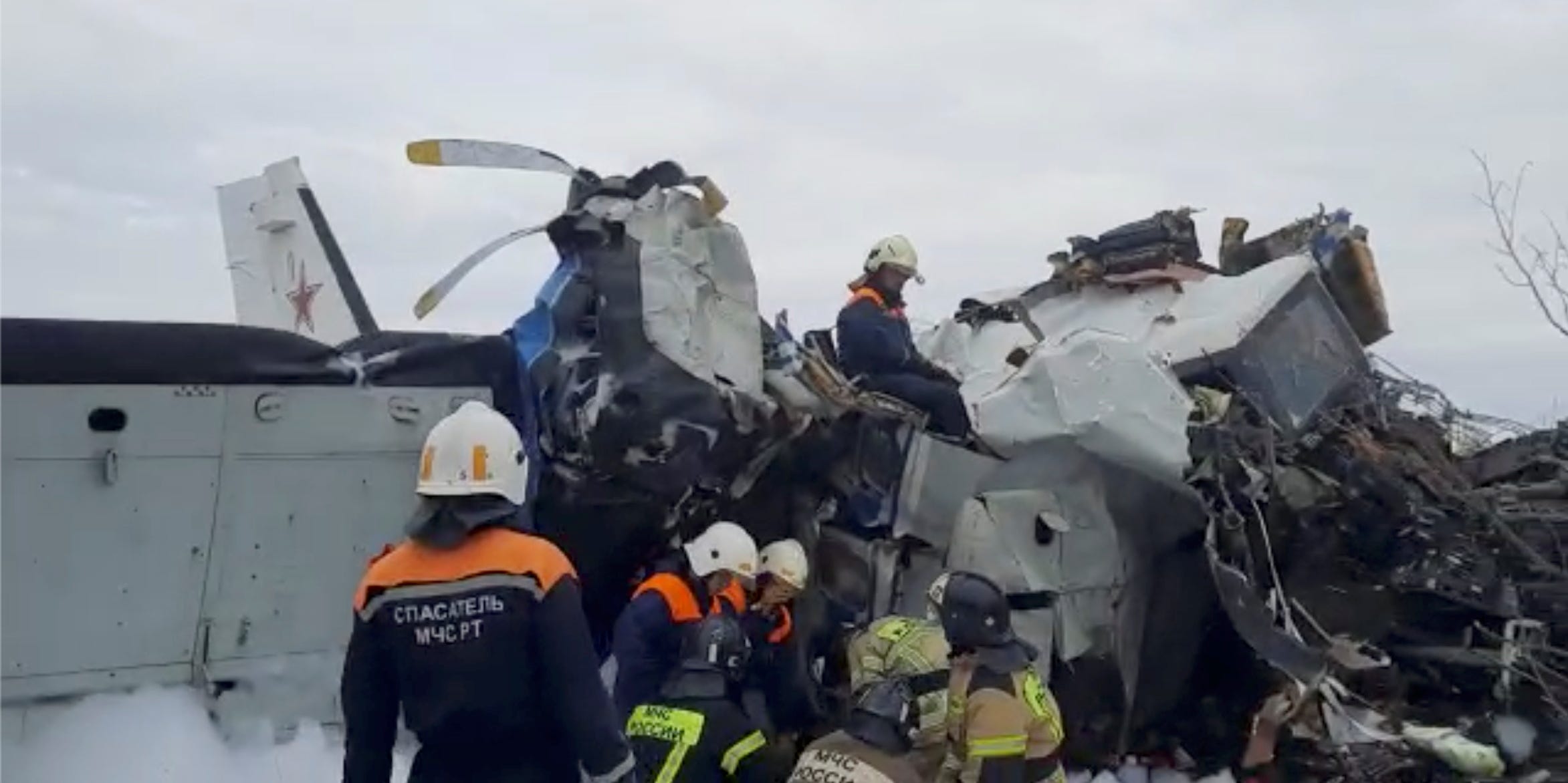 Emergency specialists work at the crash site of the L-410 plane near the town of Menzelinsk in the Republic of Tatarstan, Russia October 10, 2021