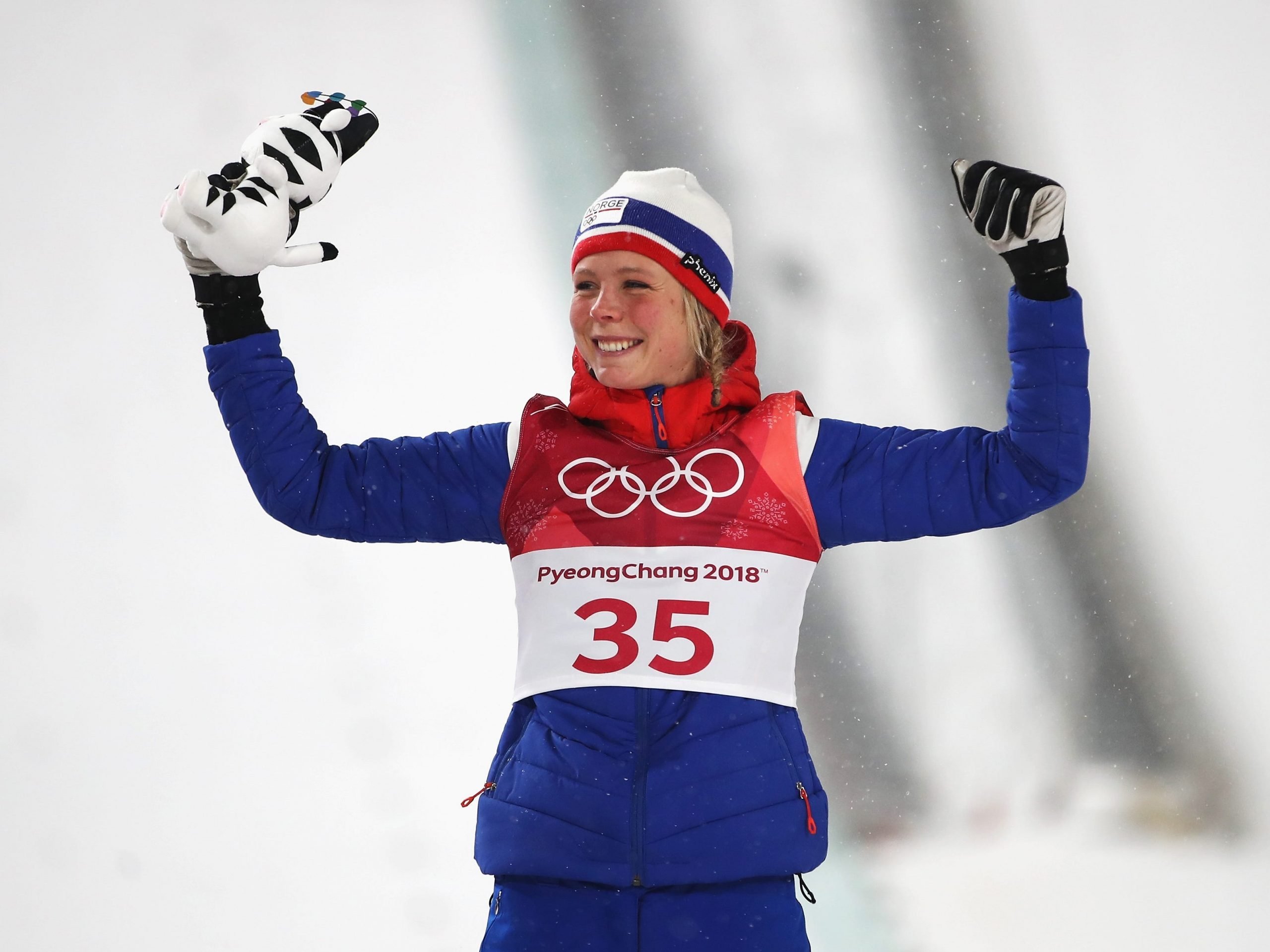 Gold medalist Maren Lundby of Norway celebrates on the podium during the victory ceremony after the Ladies' Normal Hill Individual Ski Jumping Final on day three of the PyeongChang 2018 Winter Olympic Games.