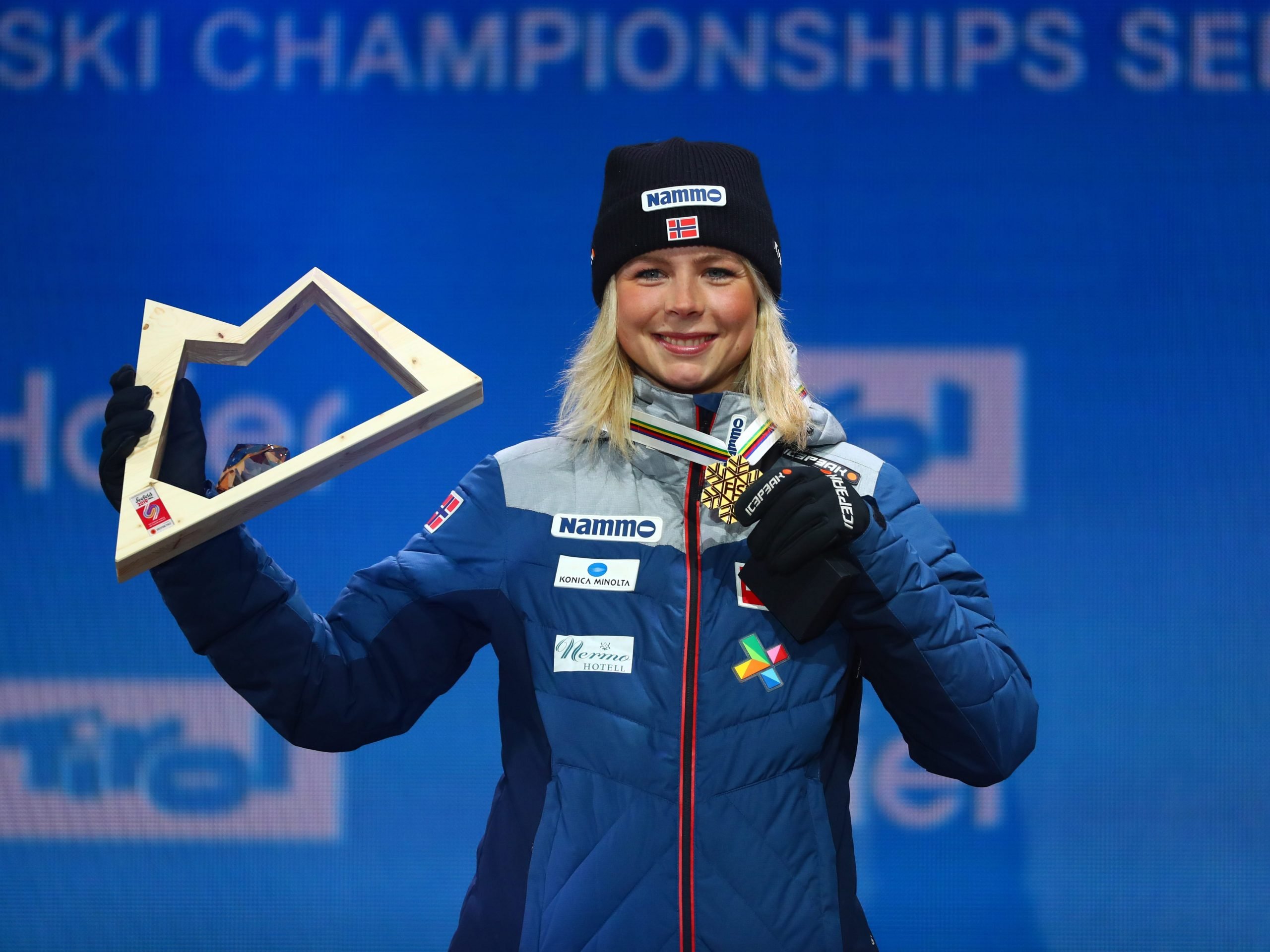 Gold medalist Norway's Maren Lundby celebrates on the podium after their SJ HS 109 Ladies Ski Jump during the medal ceremony for the at the Medal Plaza Seefeld