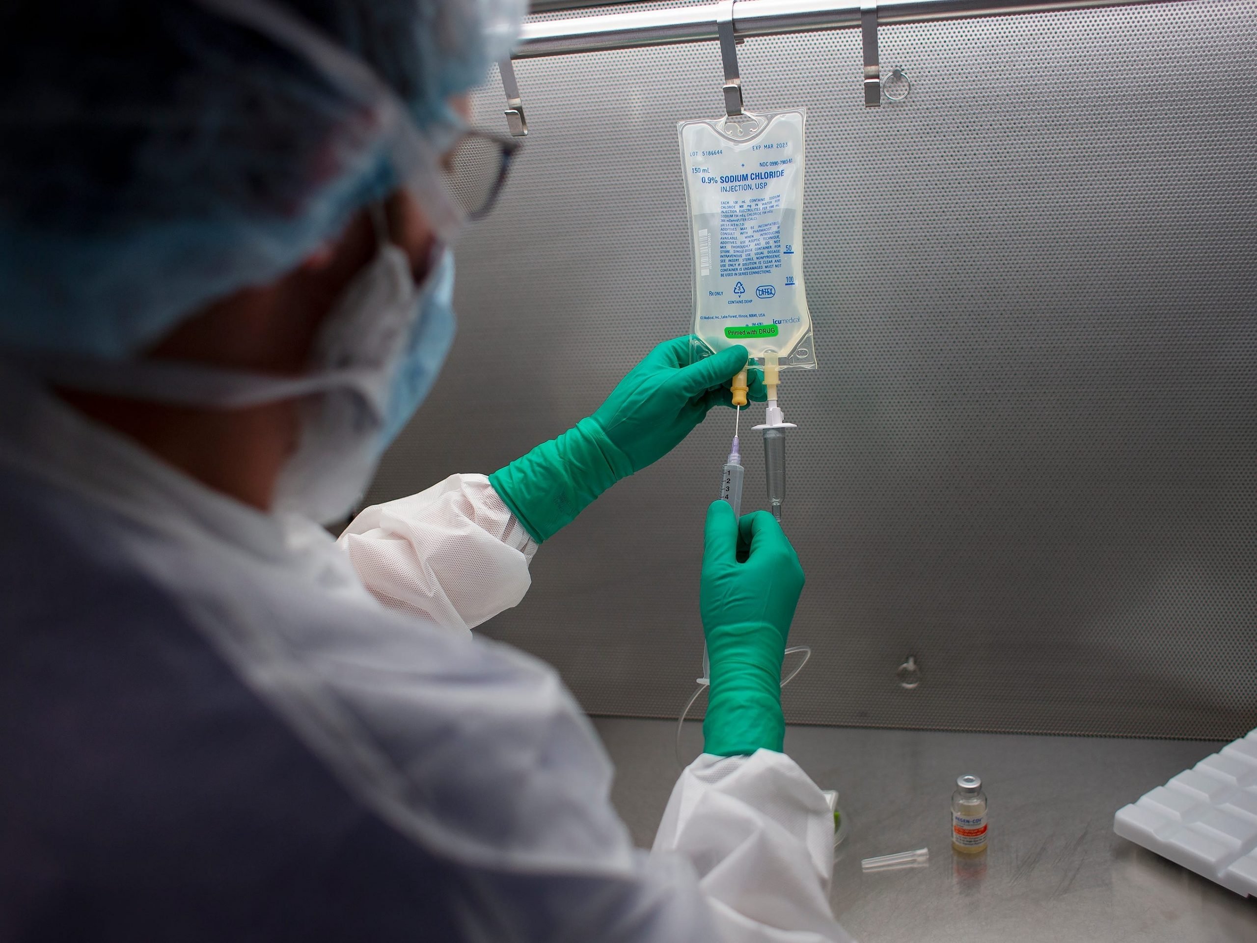 Dan Pelletier, a pharmacy technicinan specialist at Maine Medical Center, demonstrates the process of preparing anitibodies used to treat COVID19 patients.