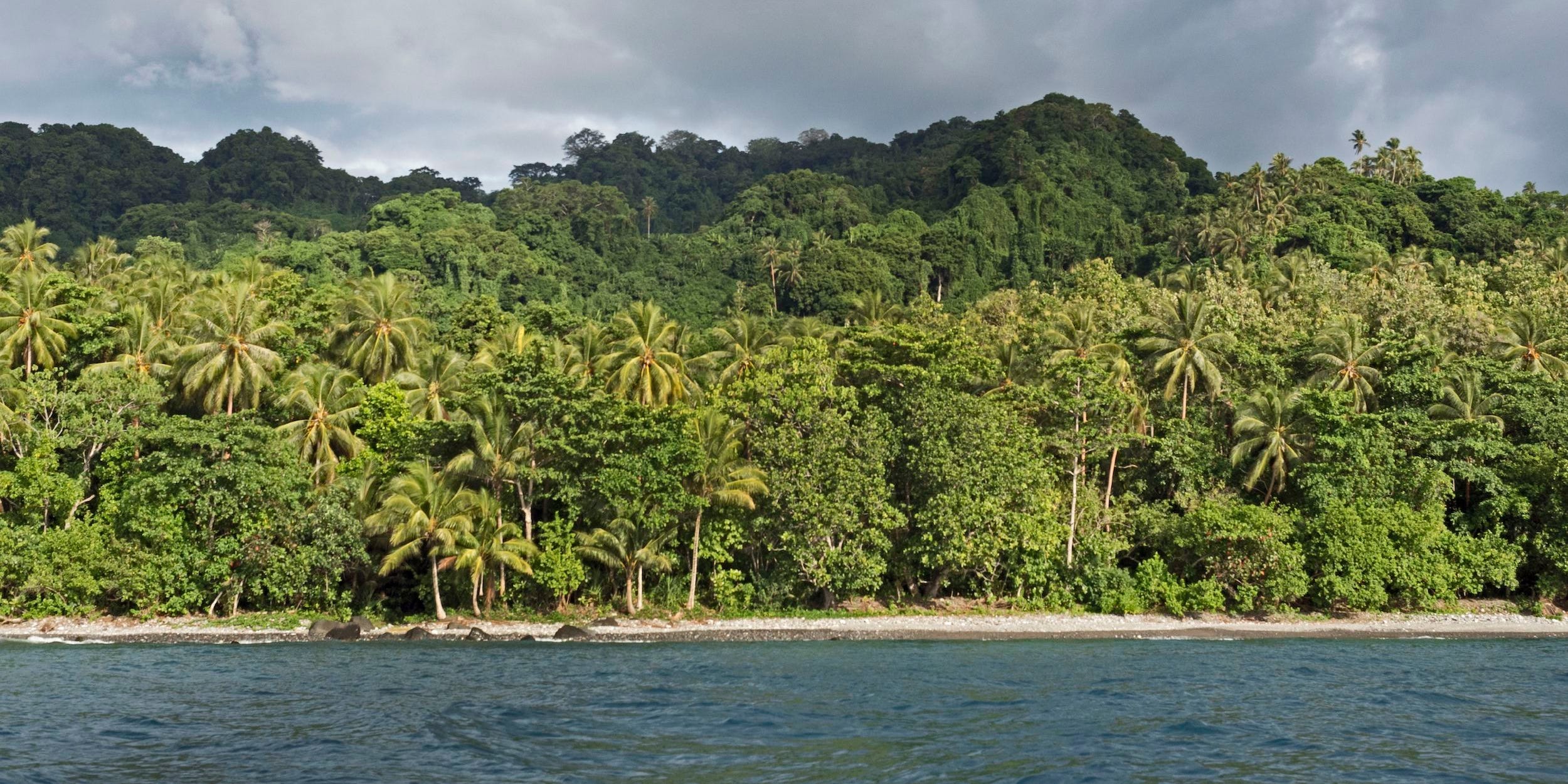 The volcanic and forest cloaked island of Savo, Solomon Islands South Pacific.