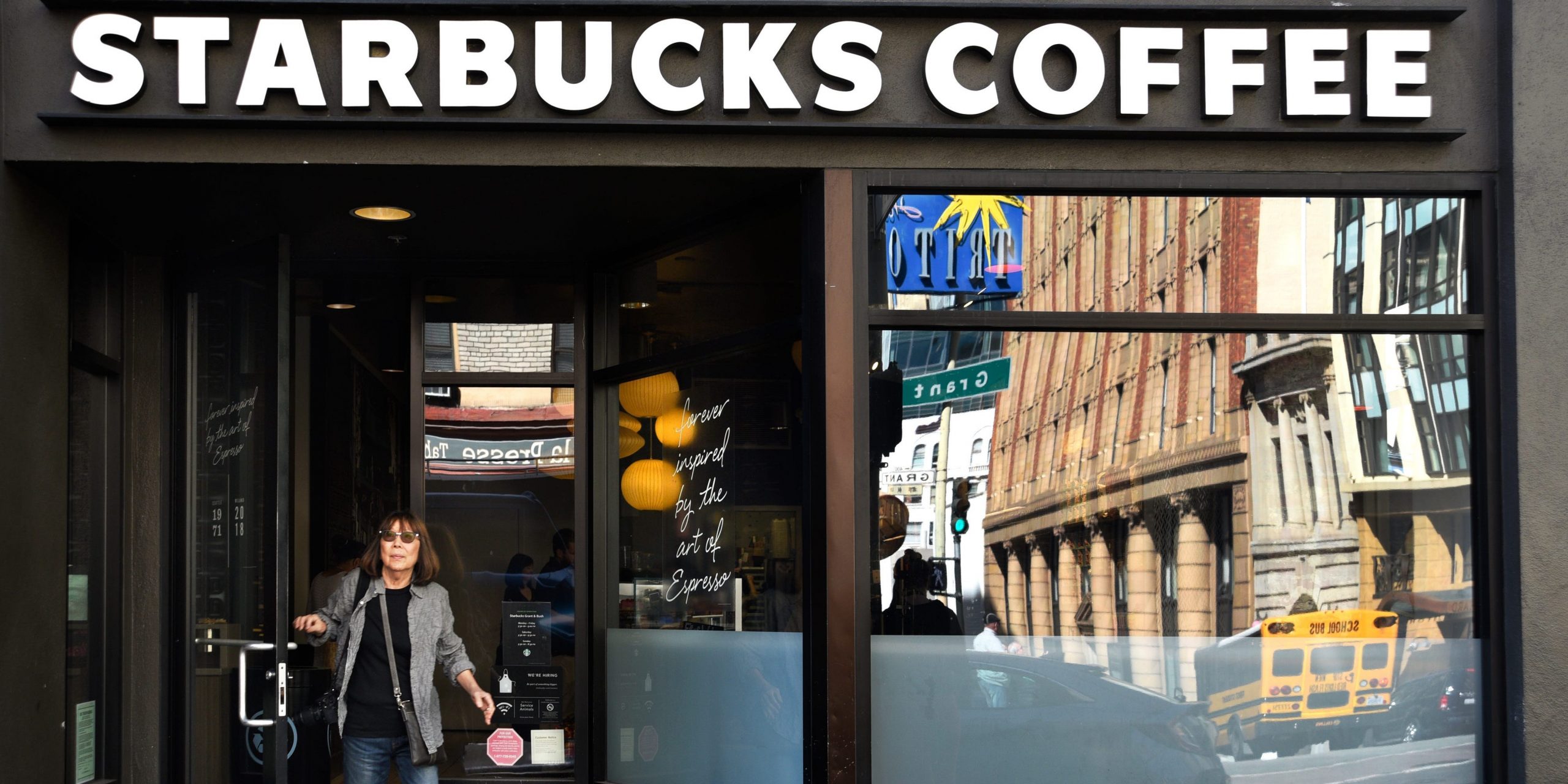 A customer leaves a Starbucks Coffee shop in San Francisco, California.