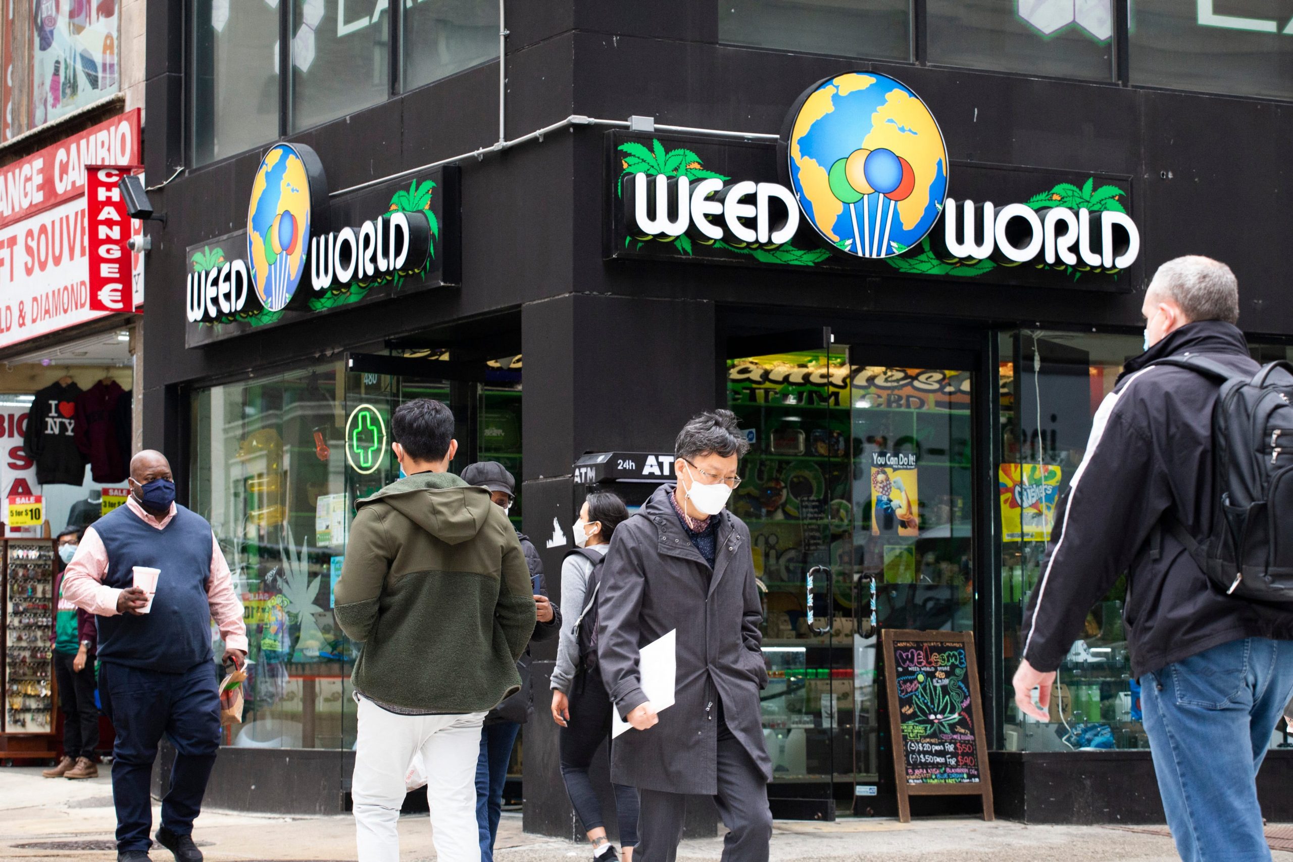 People walk past the Weed World store on March 31, 2021, in Midtown New York