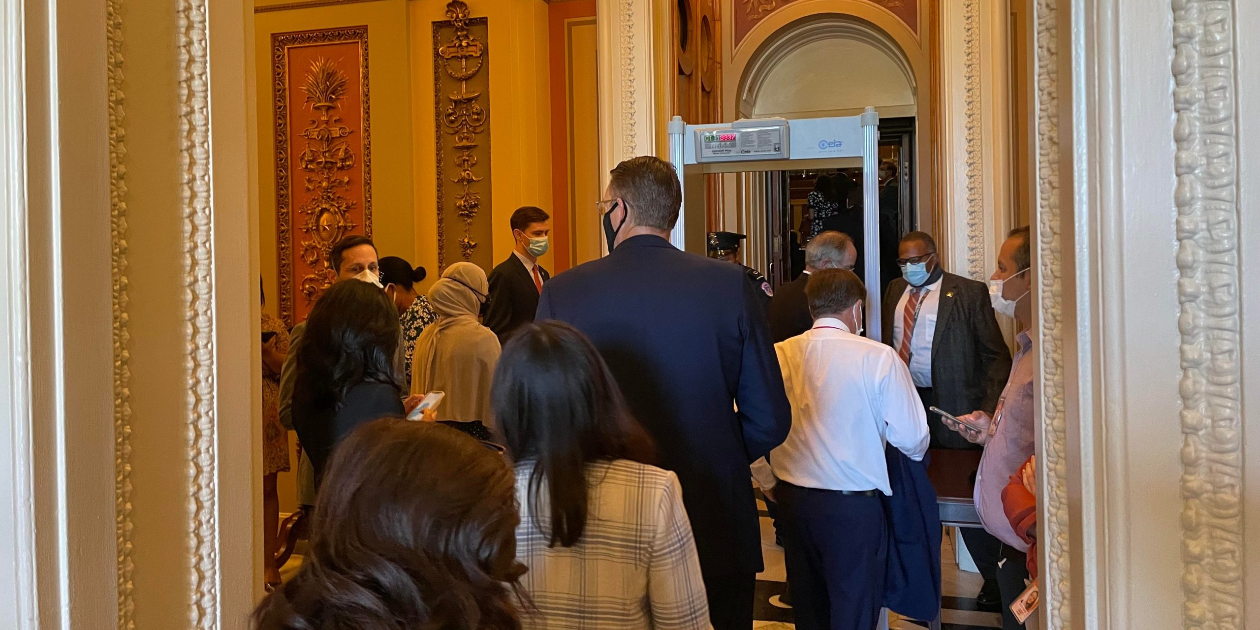 Lawmakers form a line outside of the east entrance to the House Chamber on September 24, 2021.