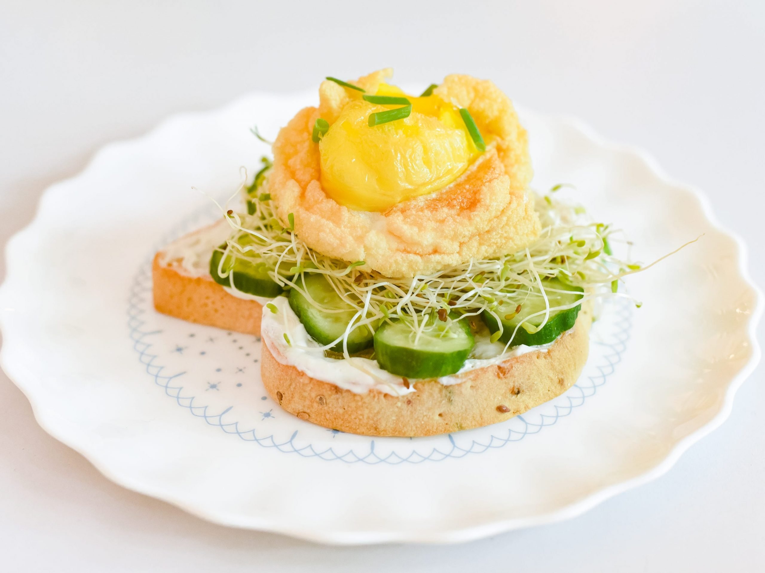 An air-fried egg on toast and bean sprouts.