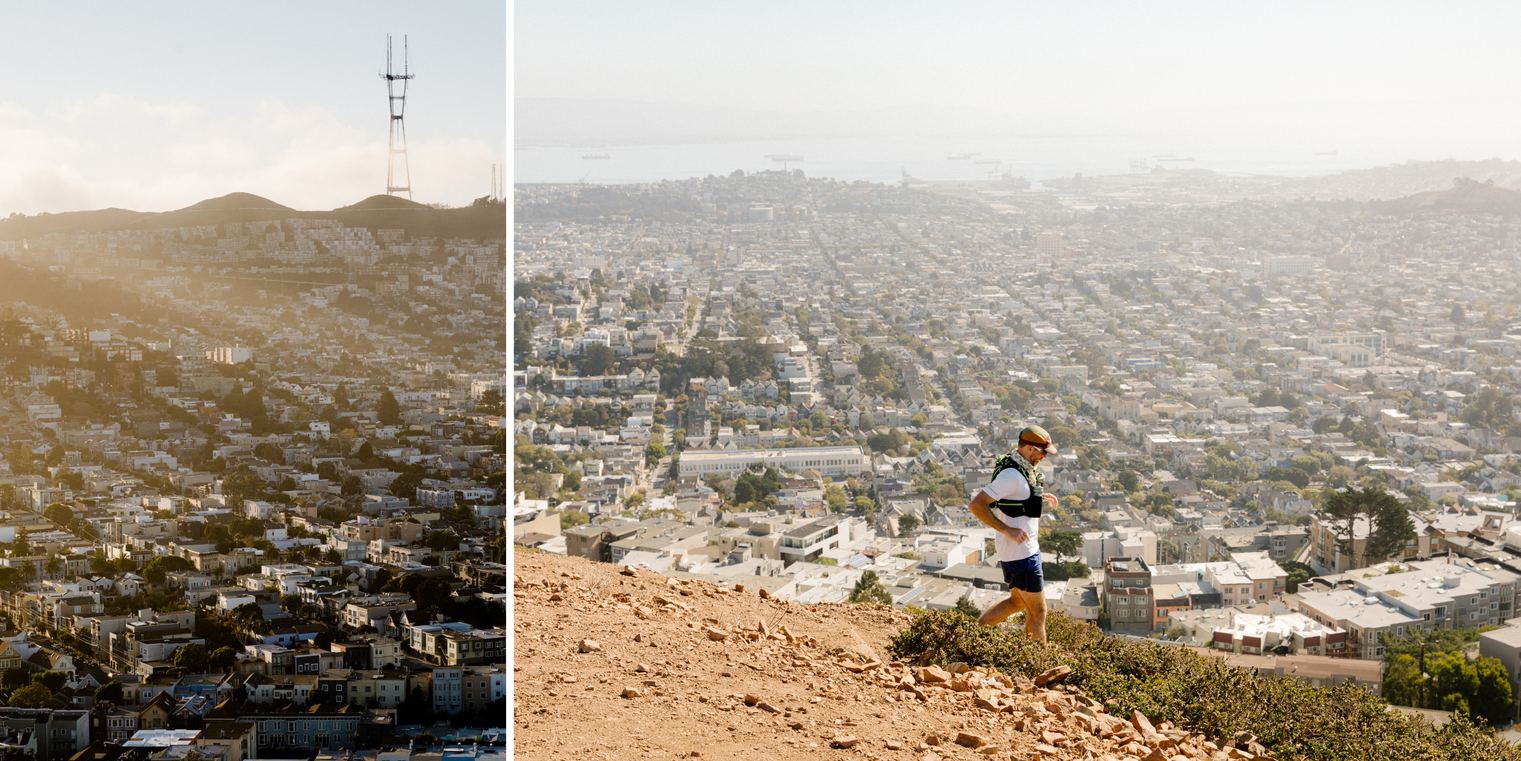 A man hikes across a Twin Peaks hill with views of San Francisco's cityscape in the background.