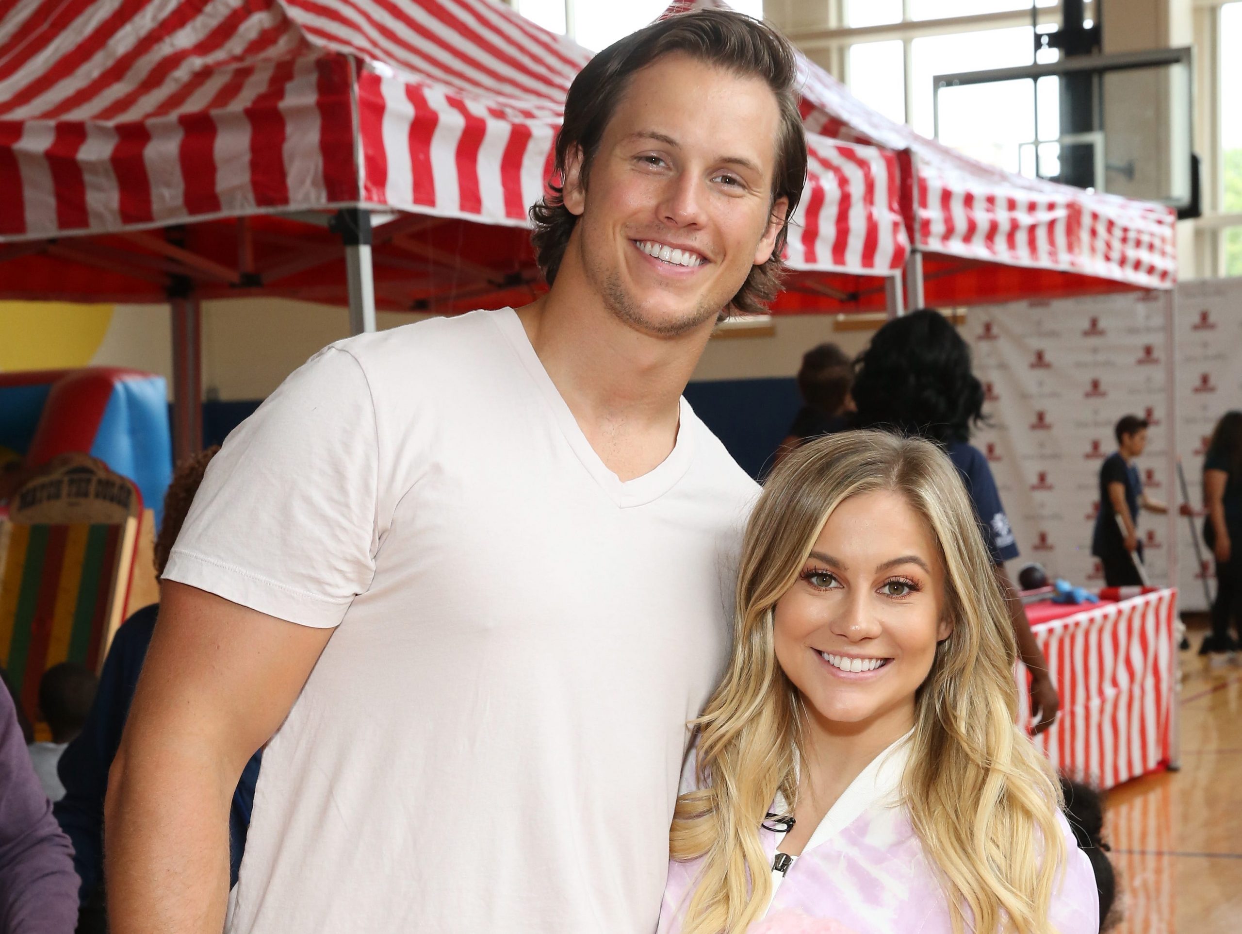 Shawn Johnson and Andrew East pose together at a back-to-school event.