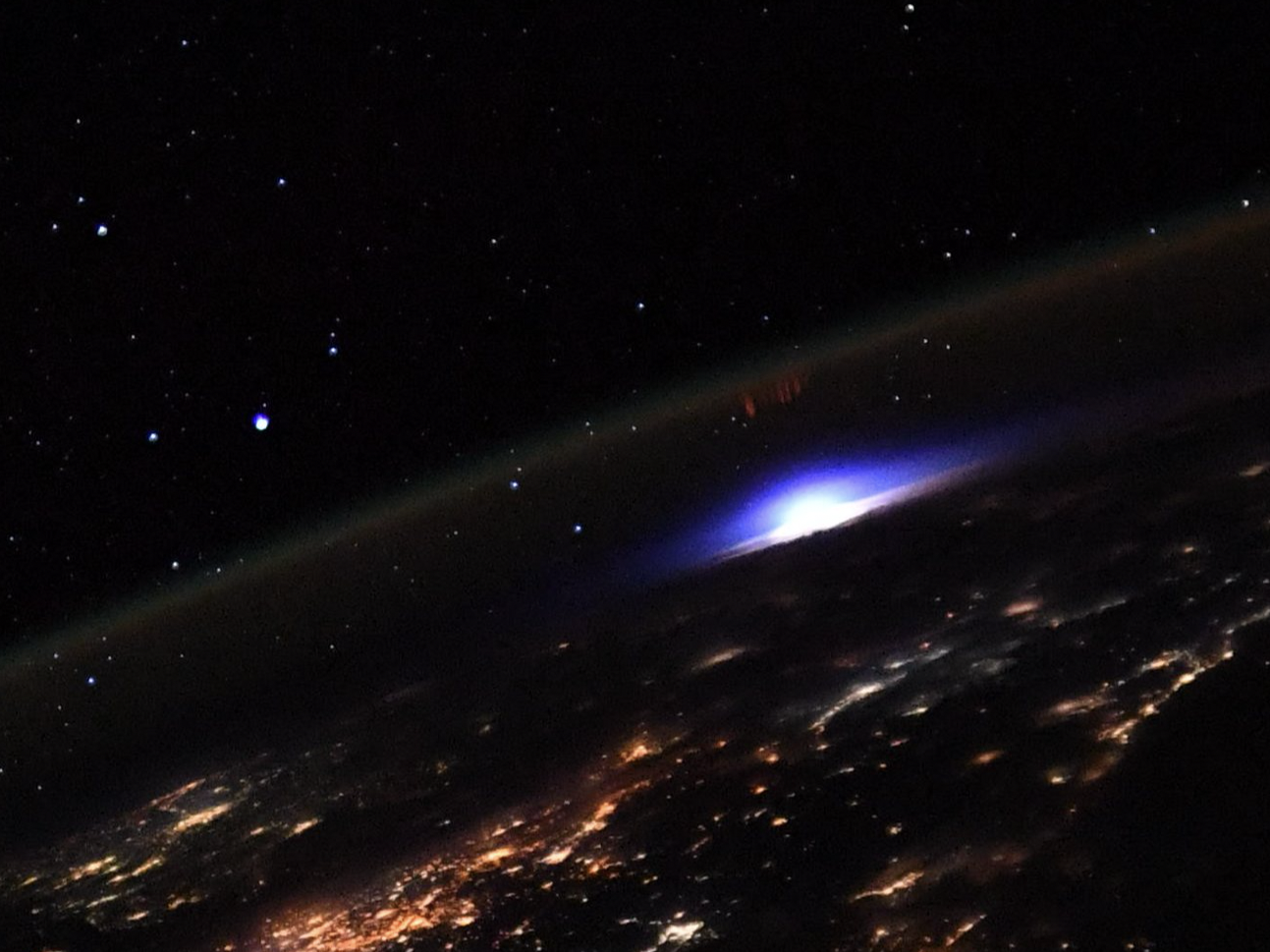 A picture of a lightning storm and a sprite snapped from the ISS.