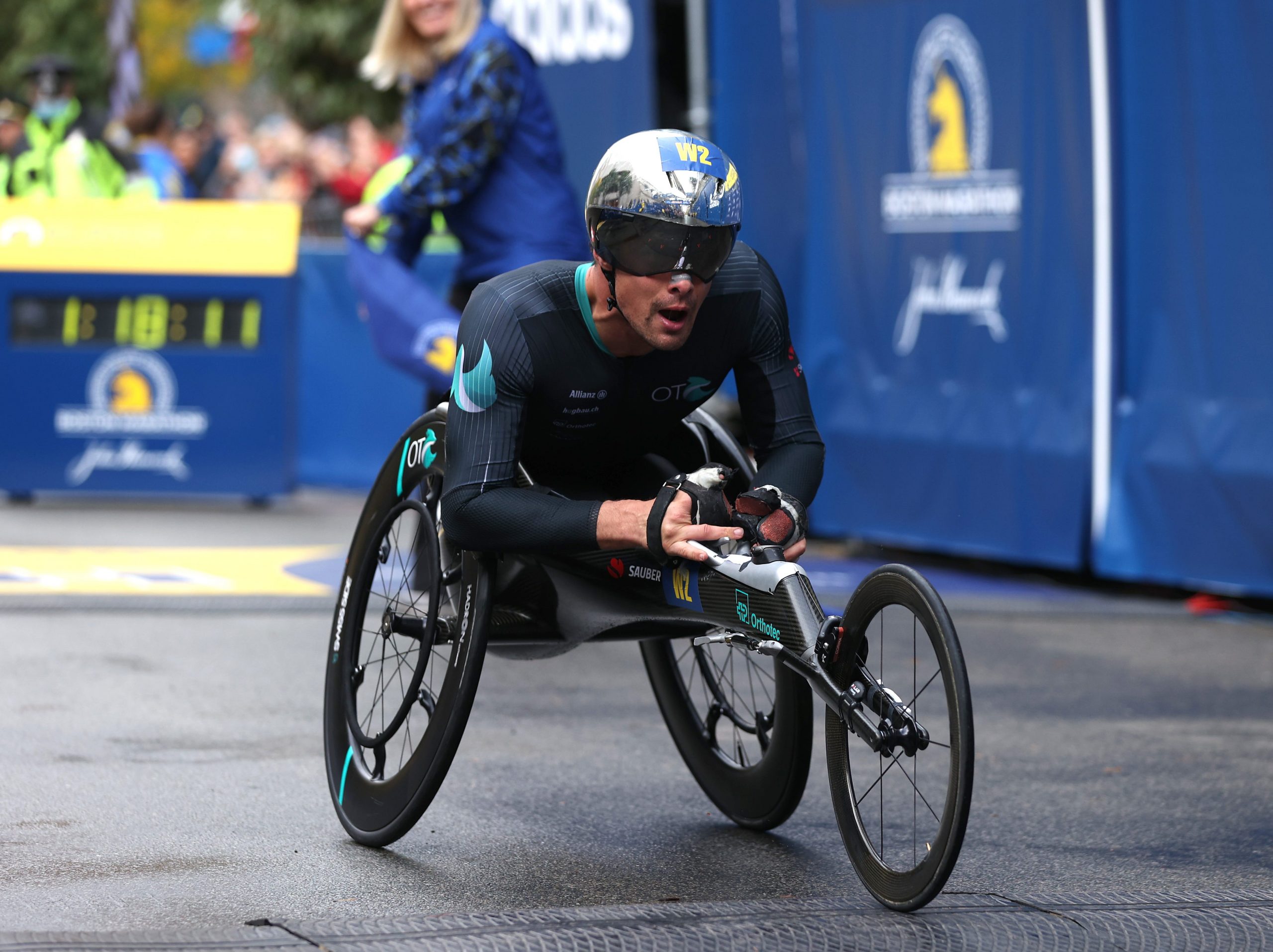 Marcel Hug of Switzerland crosses the finish line to win the men's wheelchair race during the 125th Boston Marathon