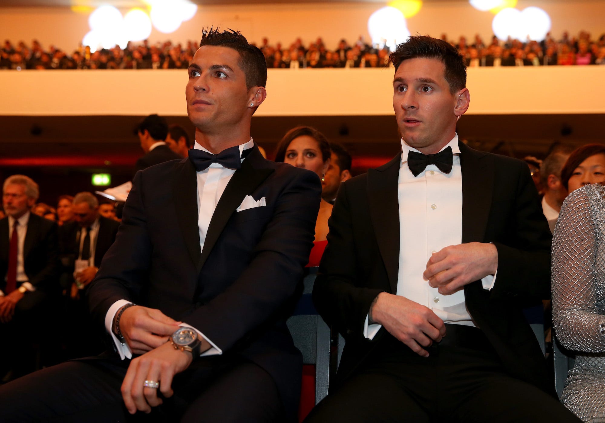 FIFA Ballon d'Or nominee Cristiano Ronaldo of Portugal and Real Madrid sits with FIFA Ballon d'Or nominee Lionel Messi of Argentina and Barcelona during the FIFA Ballon d'Or Gala 2015 at the Kongresshaus