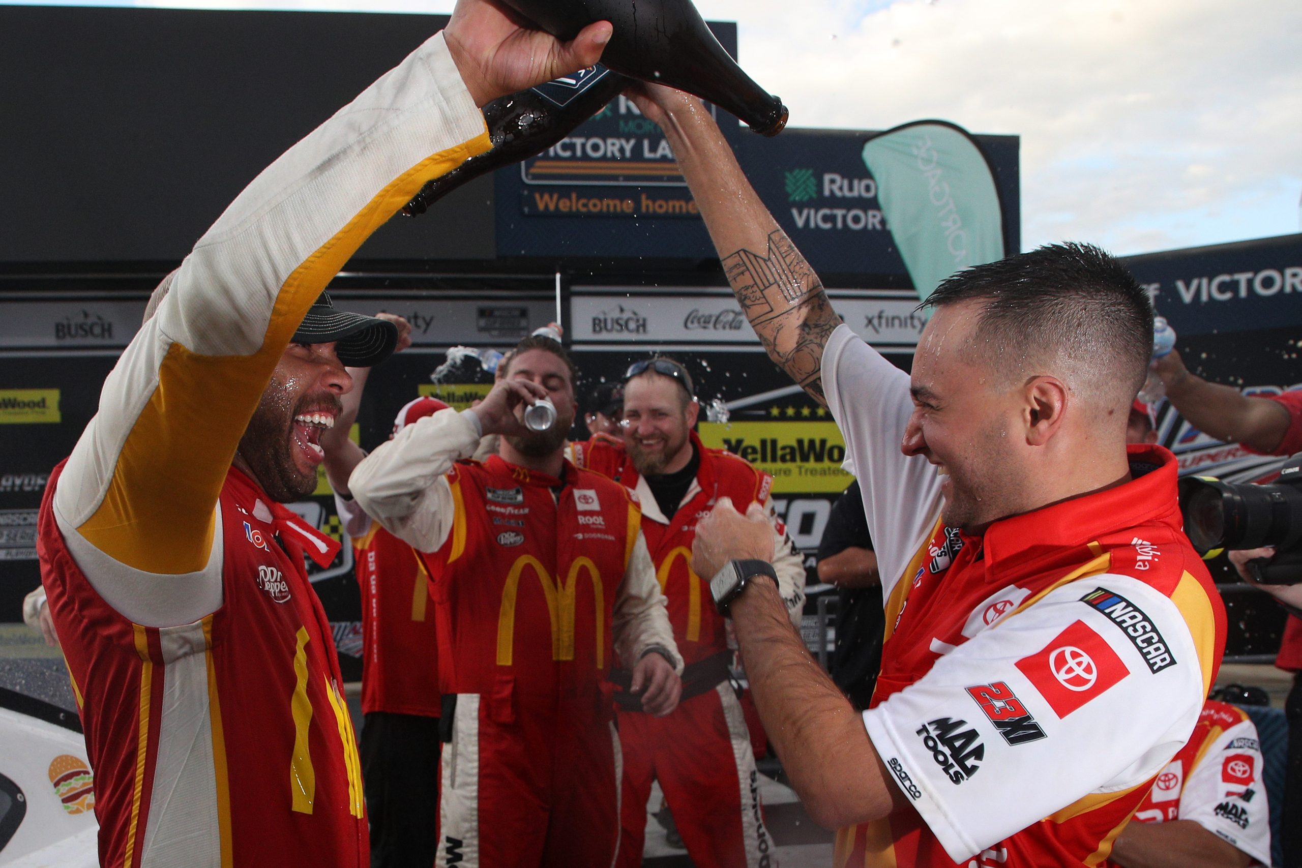 Bubba Wallace and his crew celebrating his first NASCAR Cup Series win at Talladega.