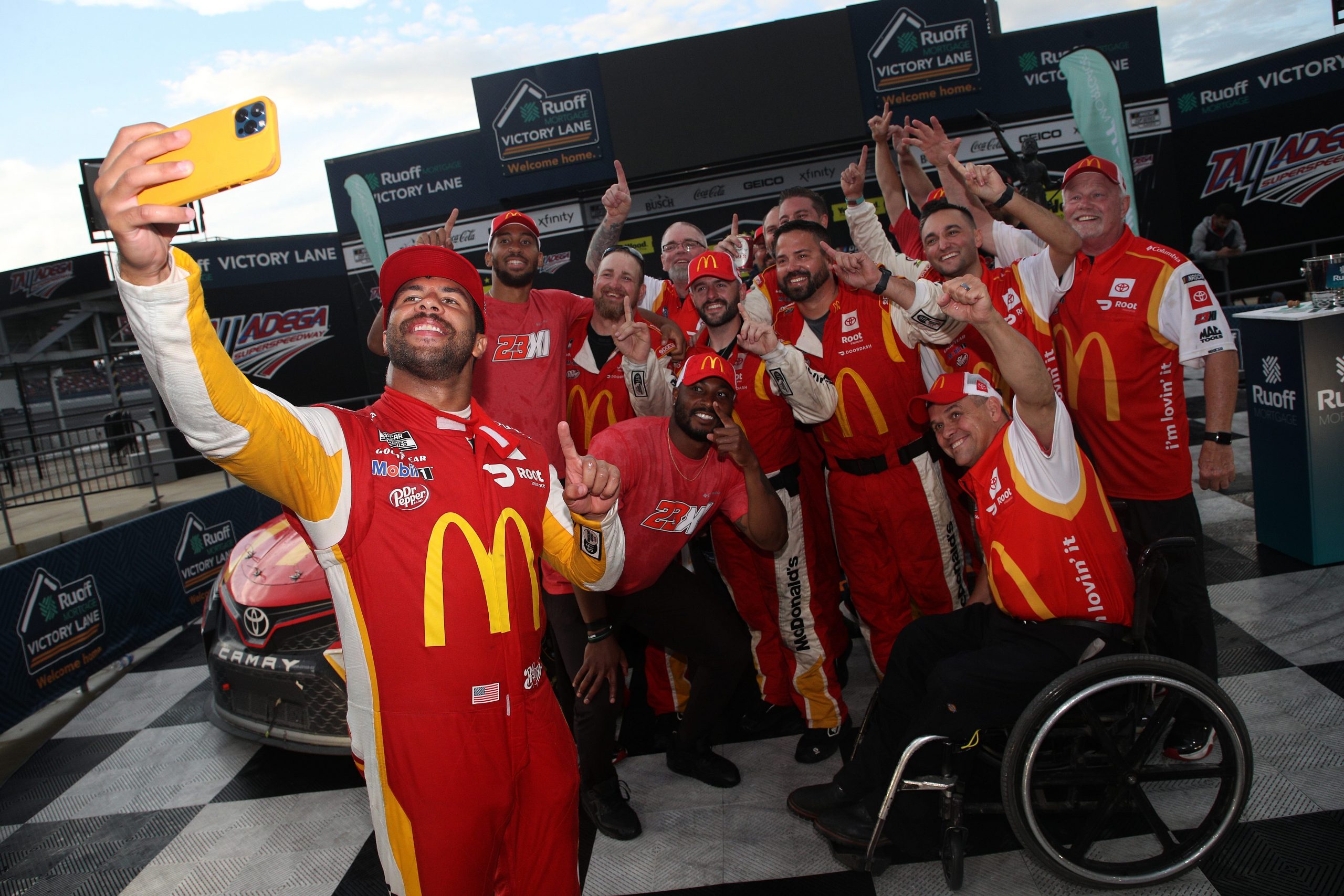 Bubba Wallace in victory lane celebrating his first NASCAR Cup Series win at Talladega Superspeedway.