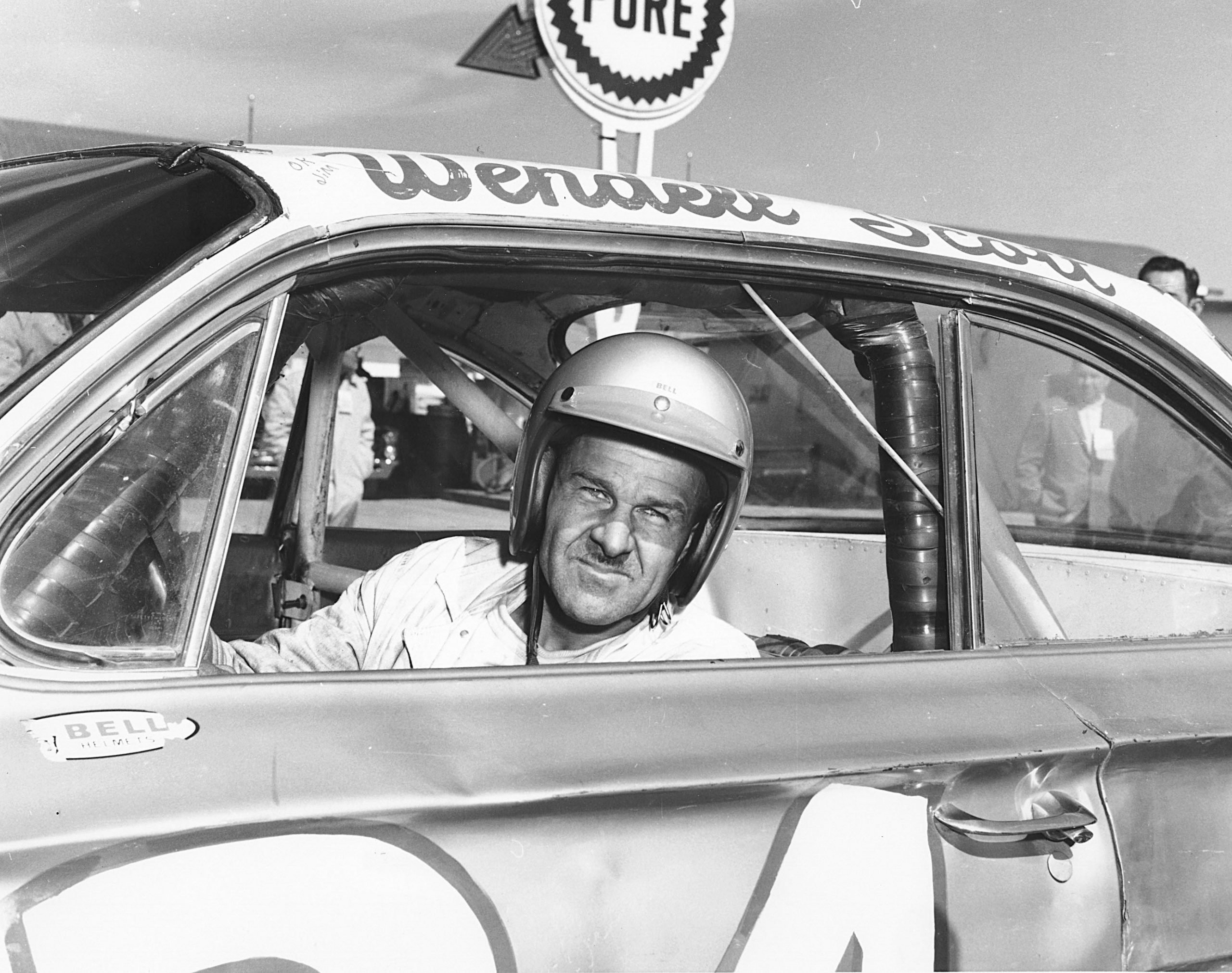 Wendell Scott, the first Black driver to win at NASCAR's top level, in his race car.