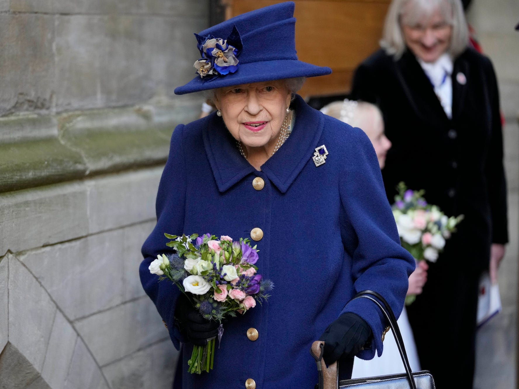 Queen Elizabeth walks with a cane.