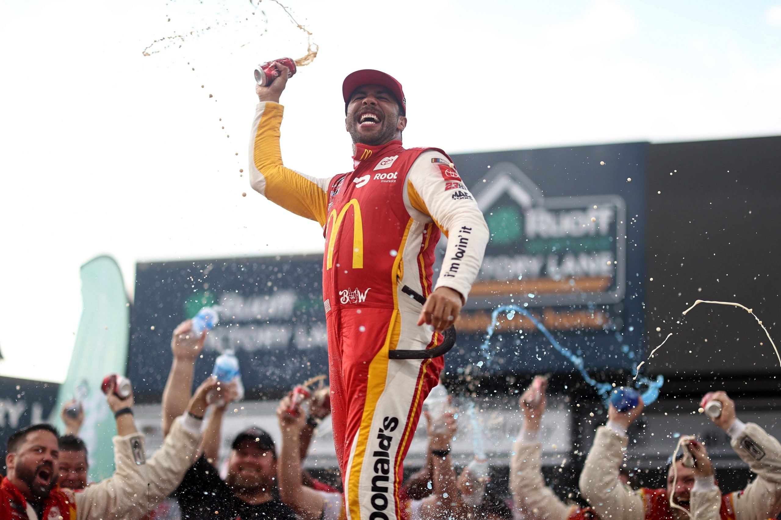 Bubba Wallace celebrating in victory lane at Talladega Superspeedway.