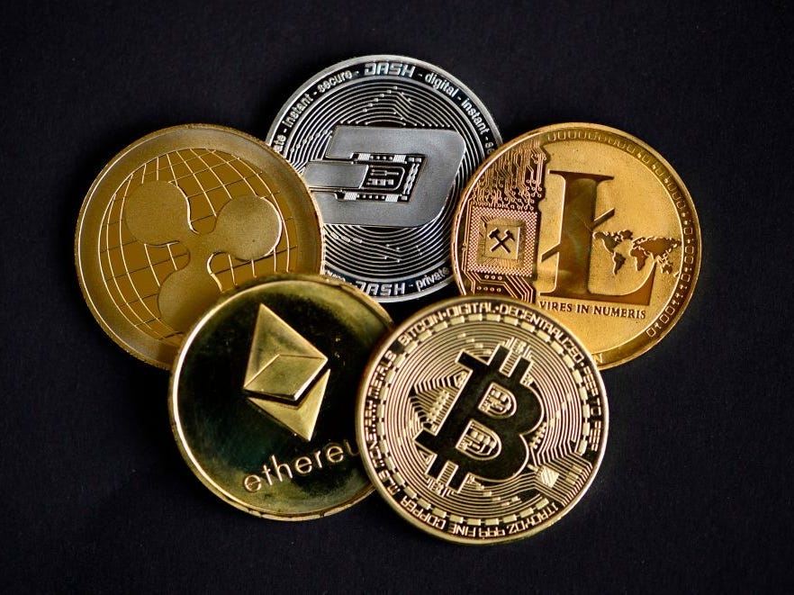 The photo shows physical imitations of cryptocurrency