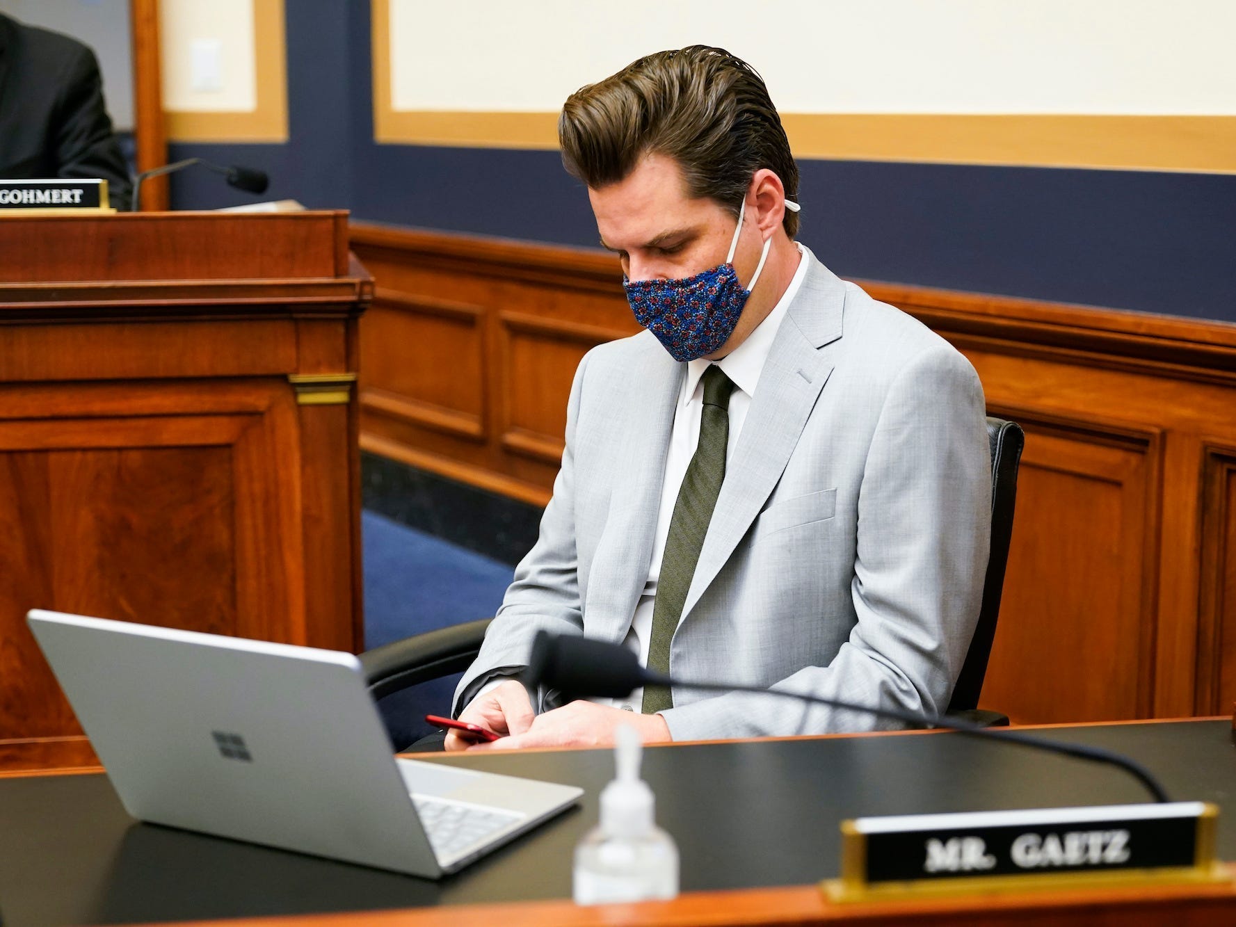 Rep. Matt Gaetz, R-Fla., looks at his phone during a House Judiciary committee hearing at the Capitol in Washington, Wednesday, April 14, 2021. (AP Photo/J. Scott Applewhite)