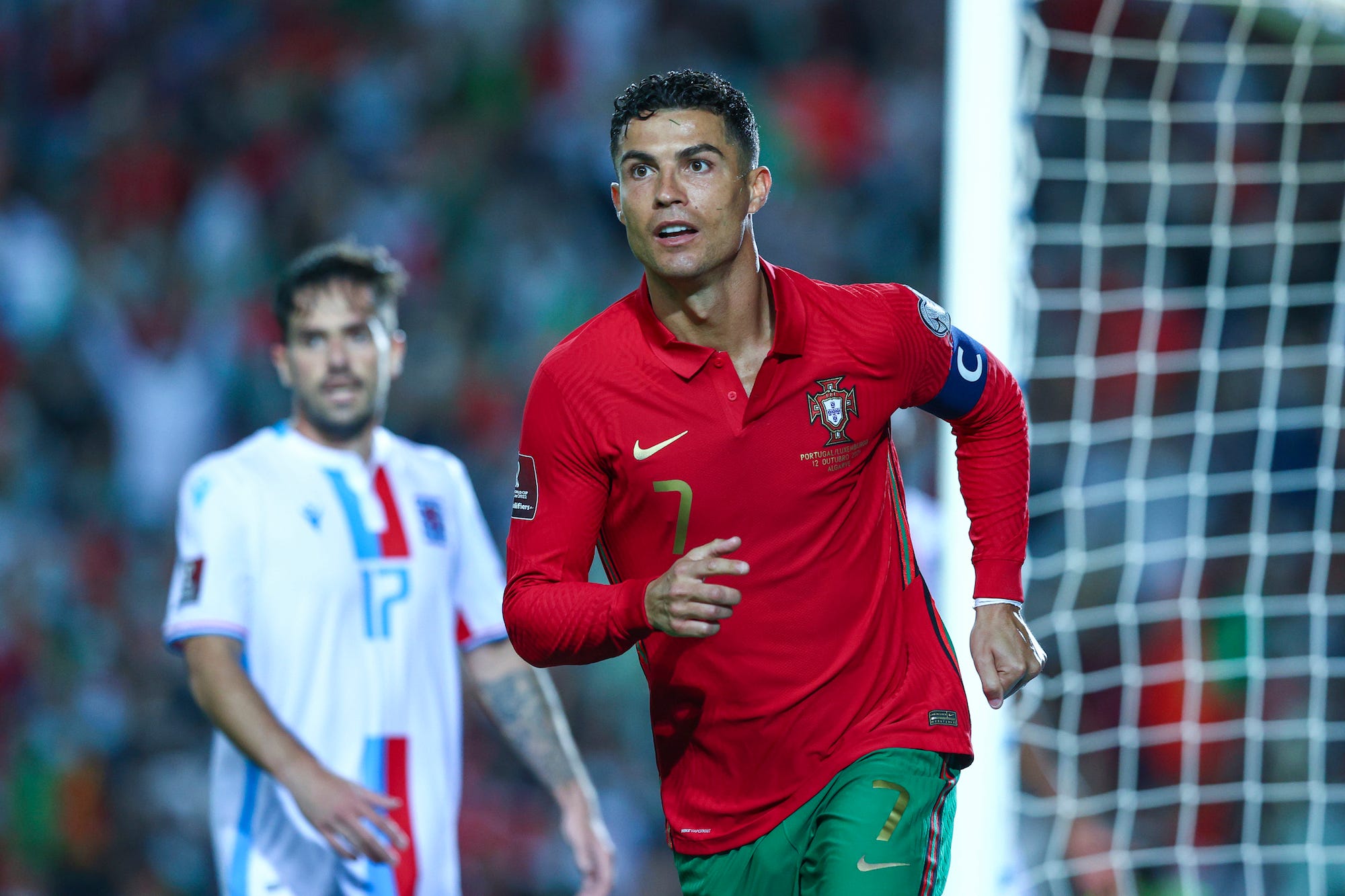 Cristiano Ronaldo of Manchester United and Portugal celebrates scoring Portugal's fifth goal and his third in the match during the 2022 FIFA World Cup Qualifier match between Portugal and Luxembourg