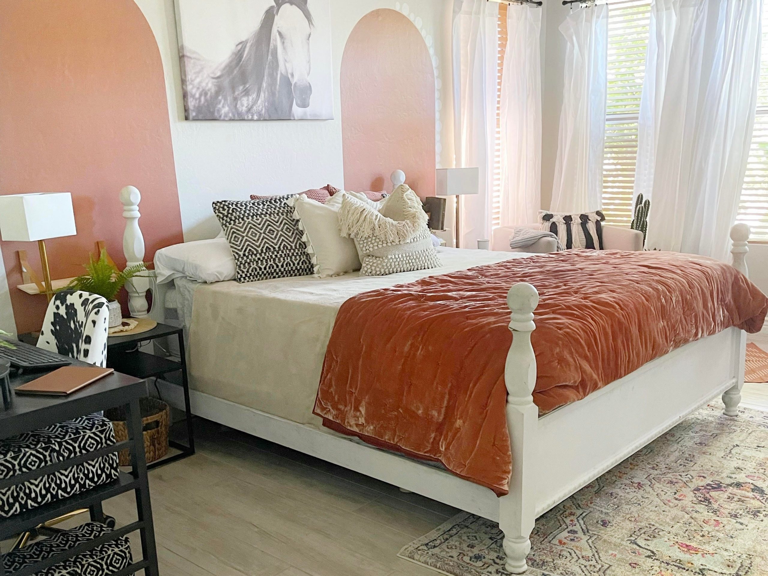 A bedroom with peel-and-stick wall decals.