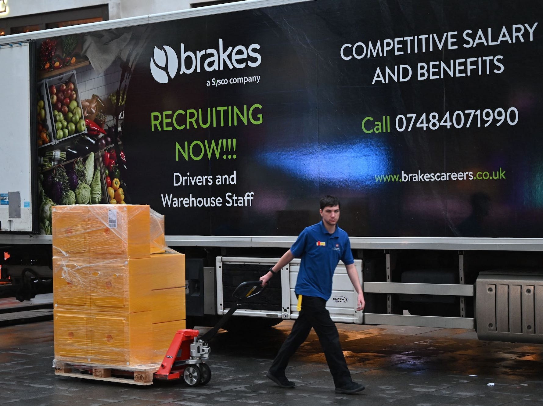 A Brakes worker unloading a lorry.
