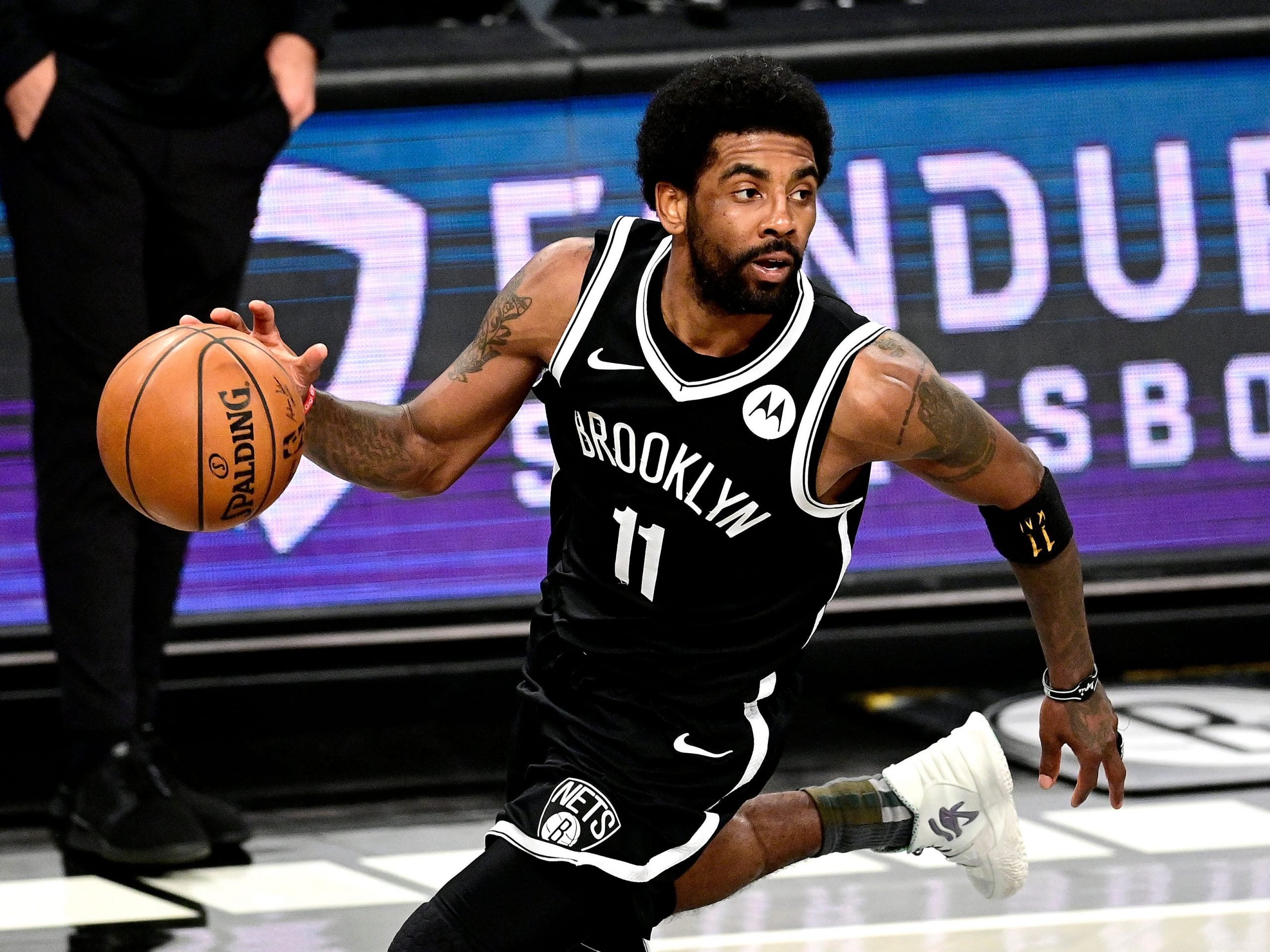 Kyrie Irving of the Brooklyn Nets handles the ball against the Milwaukee Bucks