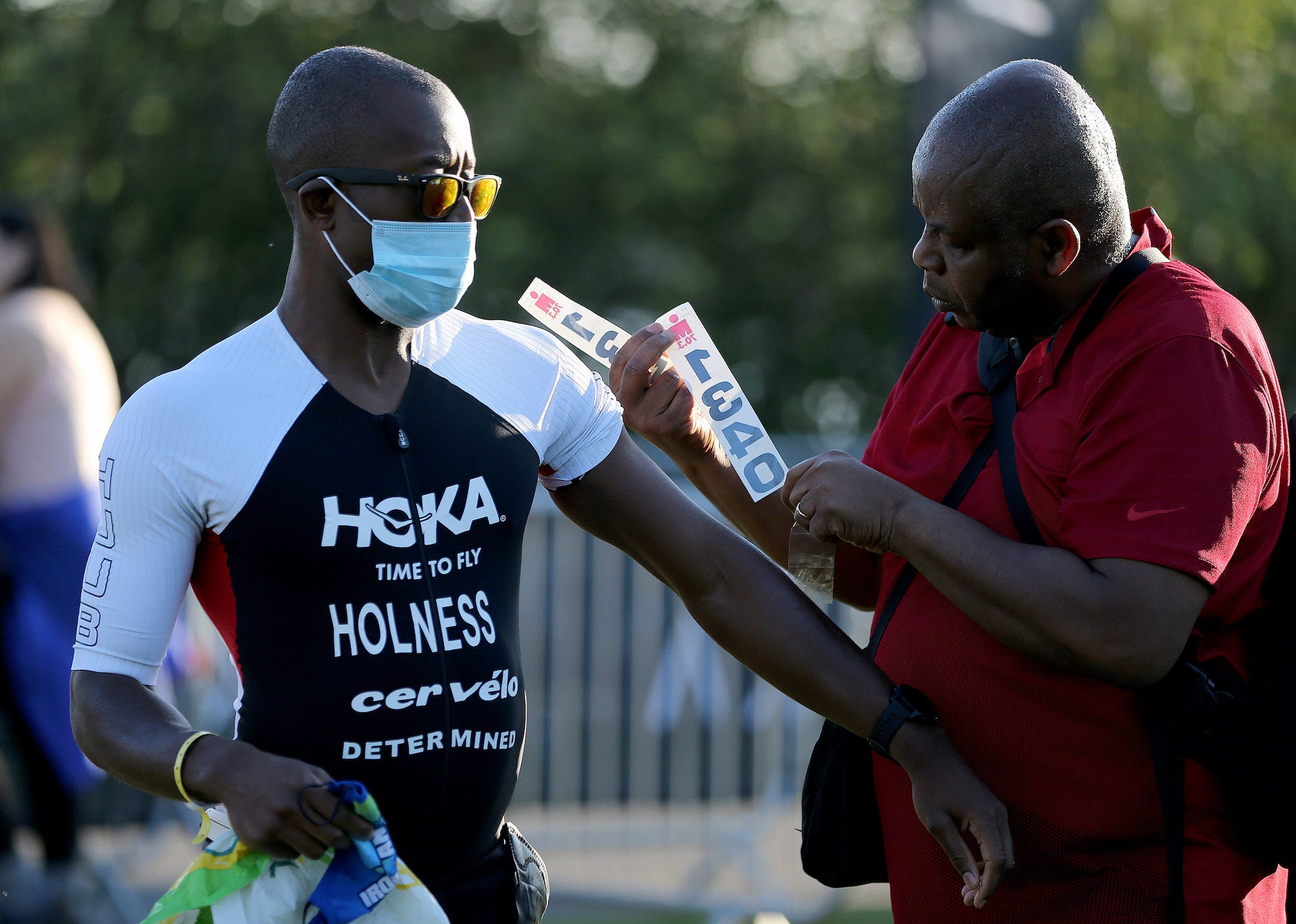 Sam Holness (L) of Britain prepares for the start of Ironman 70.3 Staffordshire