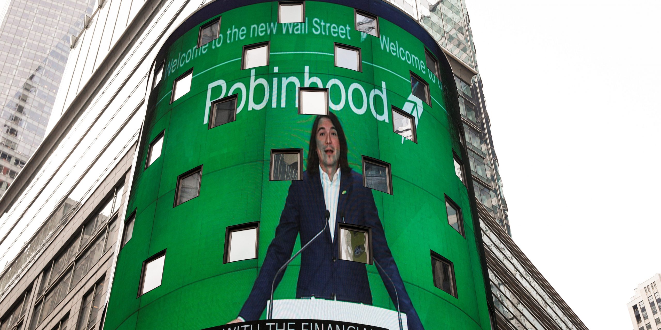 Robinhood Vlad standing at Nasdaq time square billboard