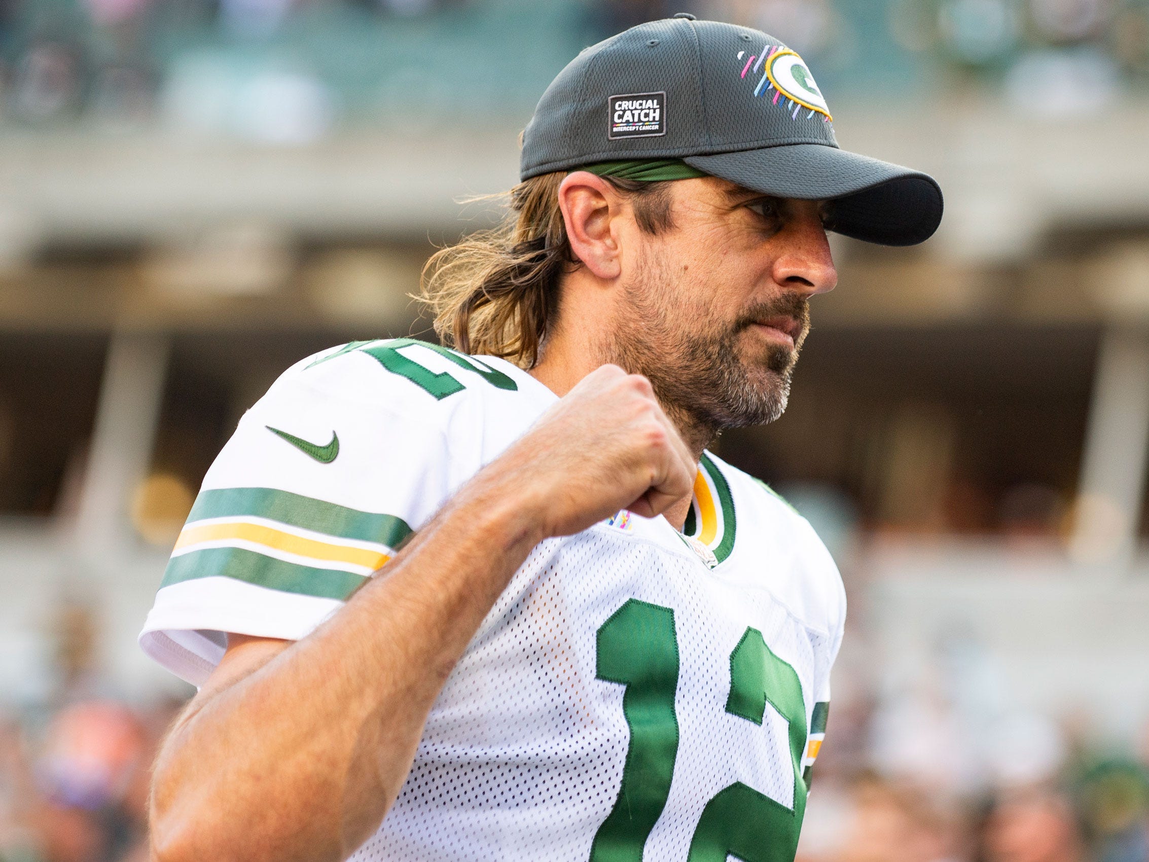 Aaron Rodgers walks off the field after a win over the Cincinnati Bengals.