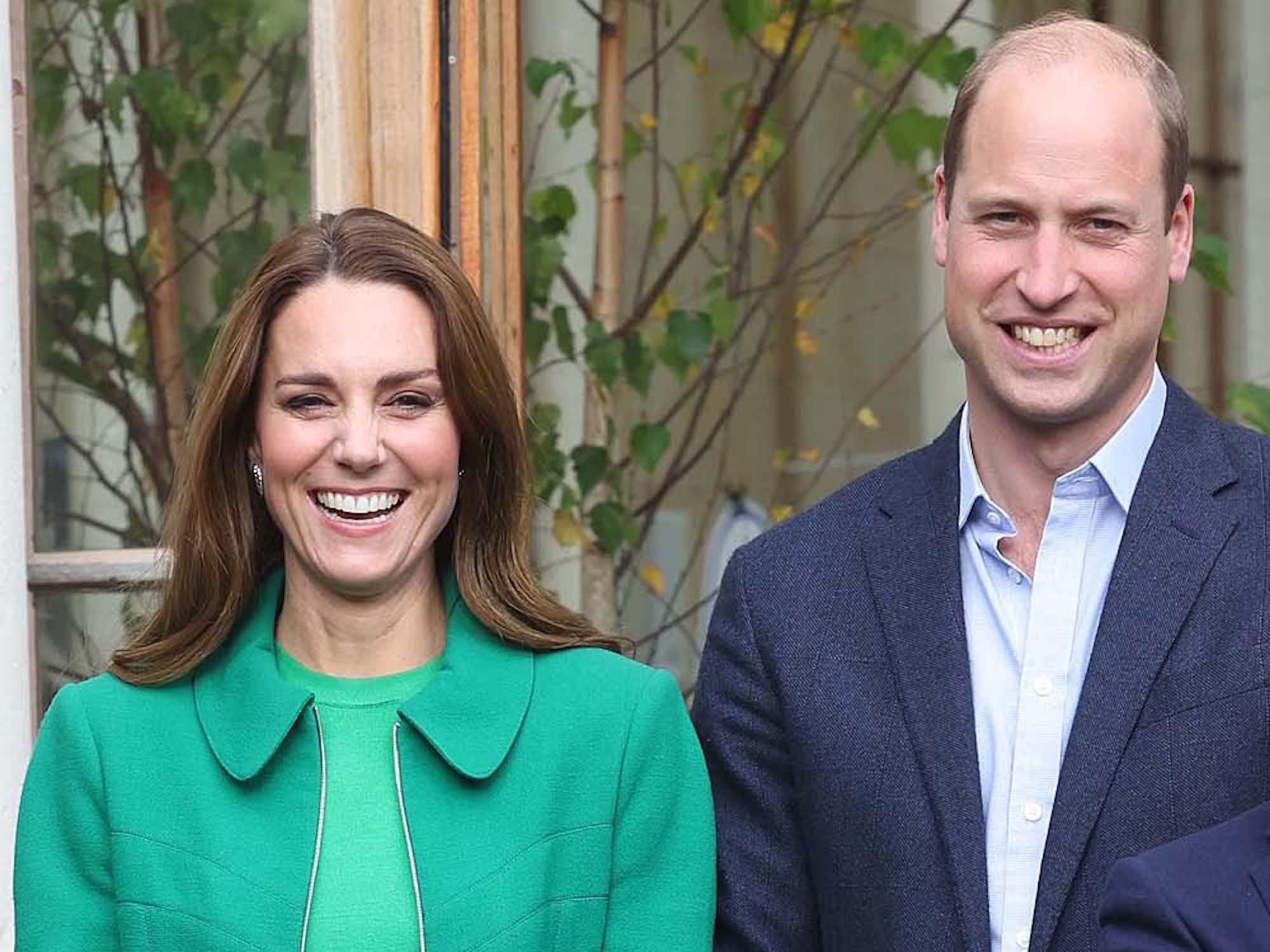 Prince William and Kate Middleton smile for a photo.