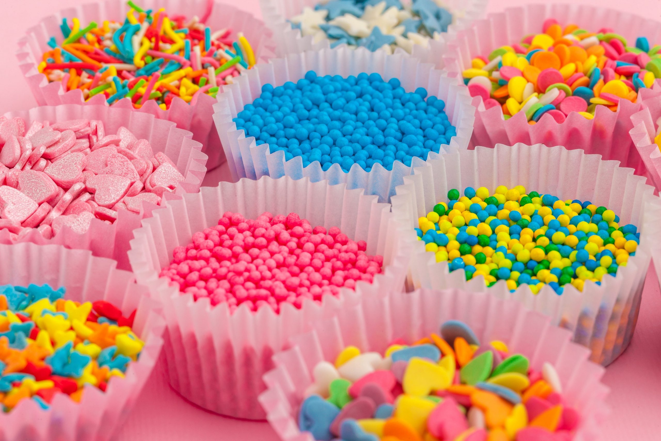 colorful sprinkles in cupcake papers