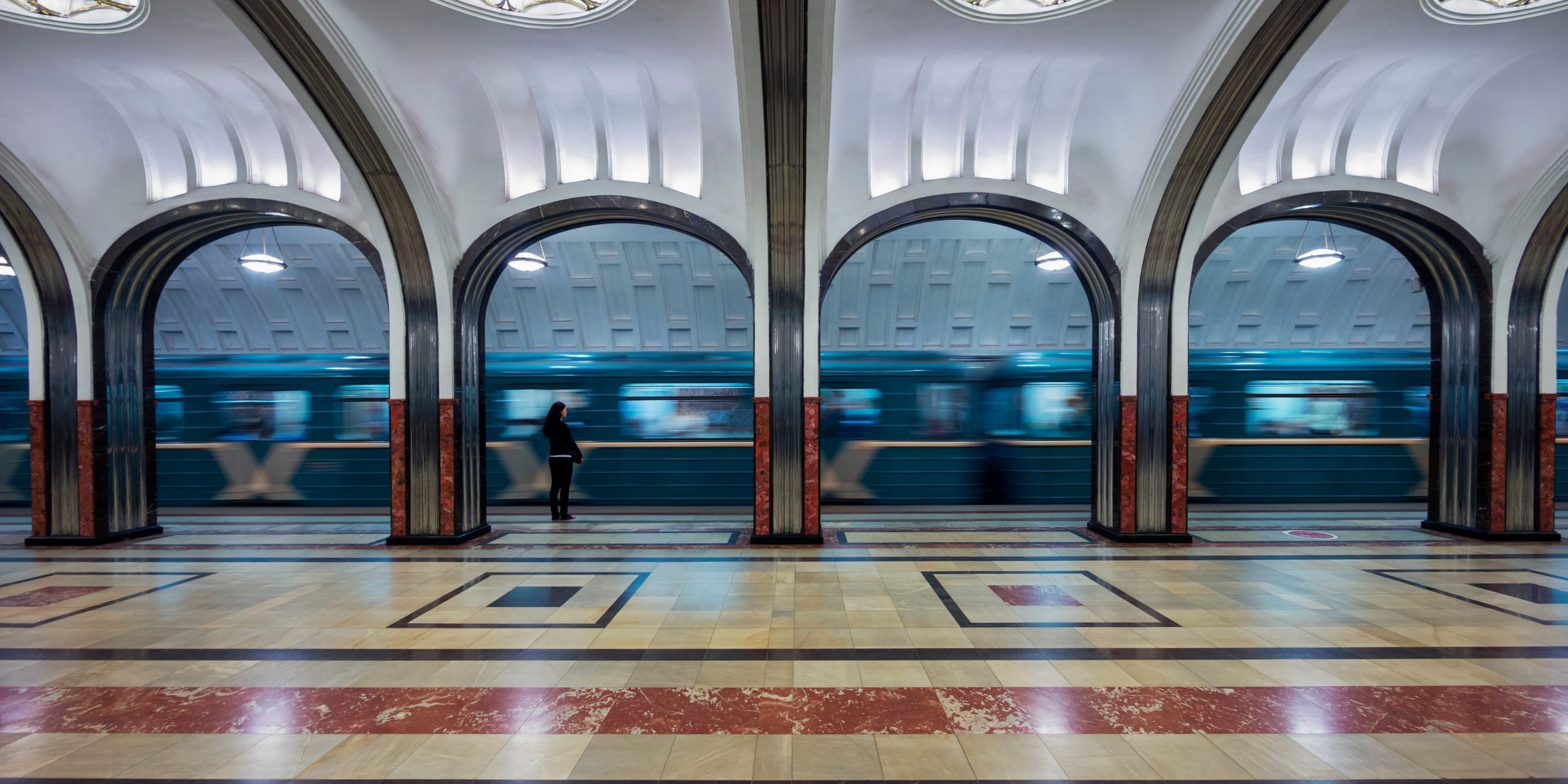 A subway train is seen moving through Mayakovskaya station in Moscow, Russia.