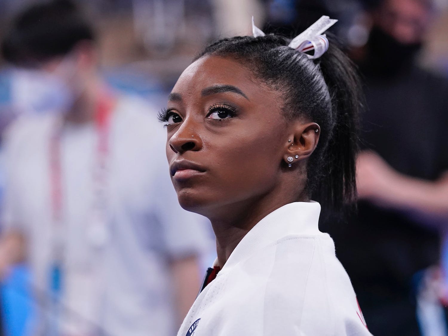 Simone Biles looks on during the Tokyo Olympics.